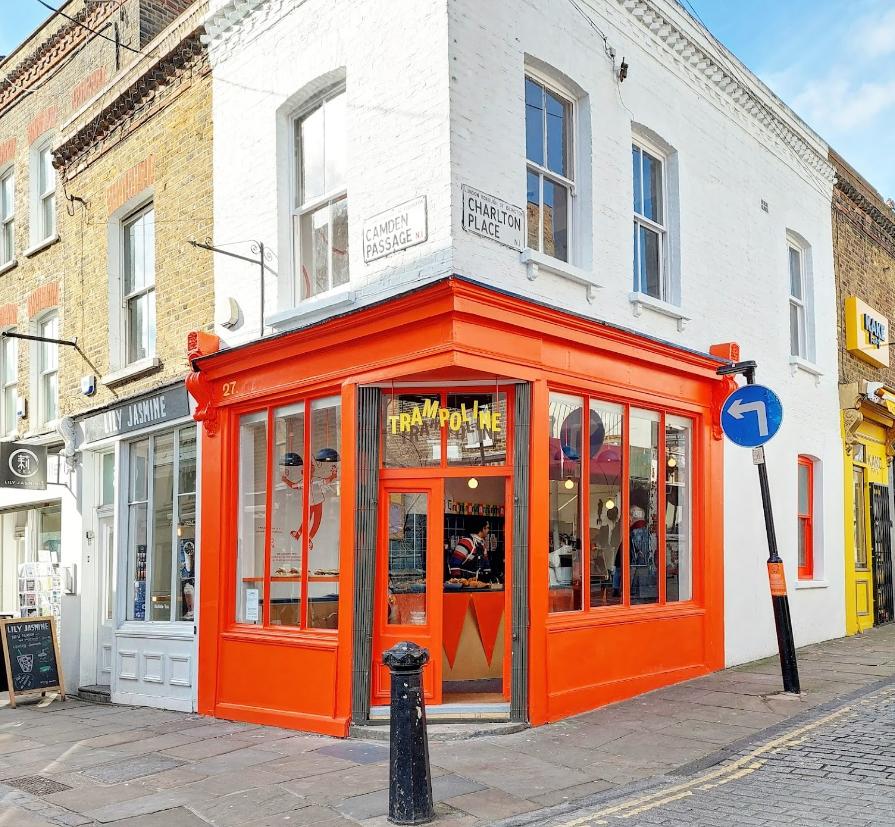 Vibrant orange trampoline venue for creative meetings and networking events.