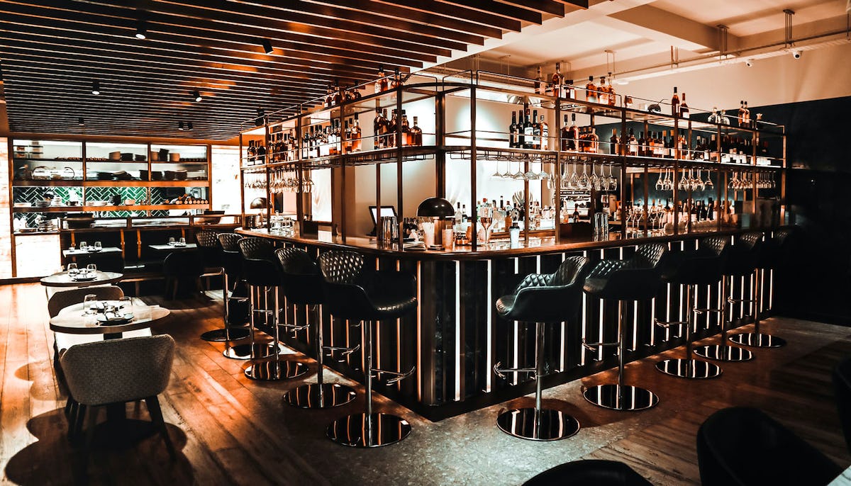 Sleek bar area in Farzi London, perfect for intimate gatherings and networking events.