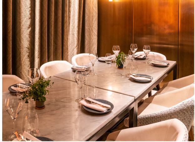 Elegant dining table at Farzi London, perfect for upscale events and intimate meetings.