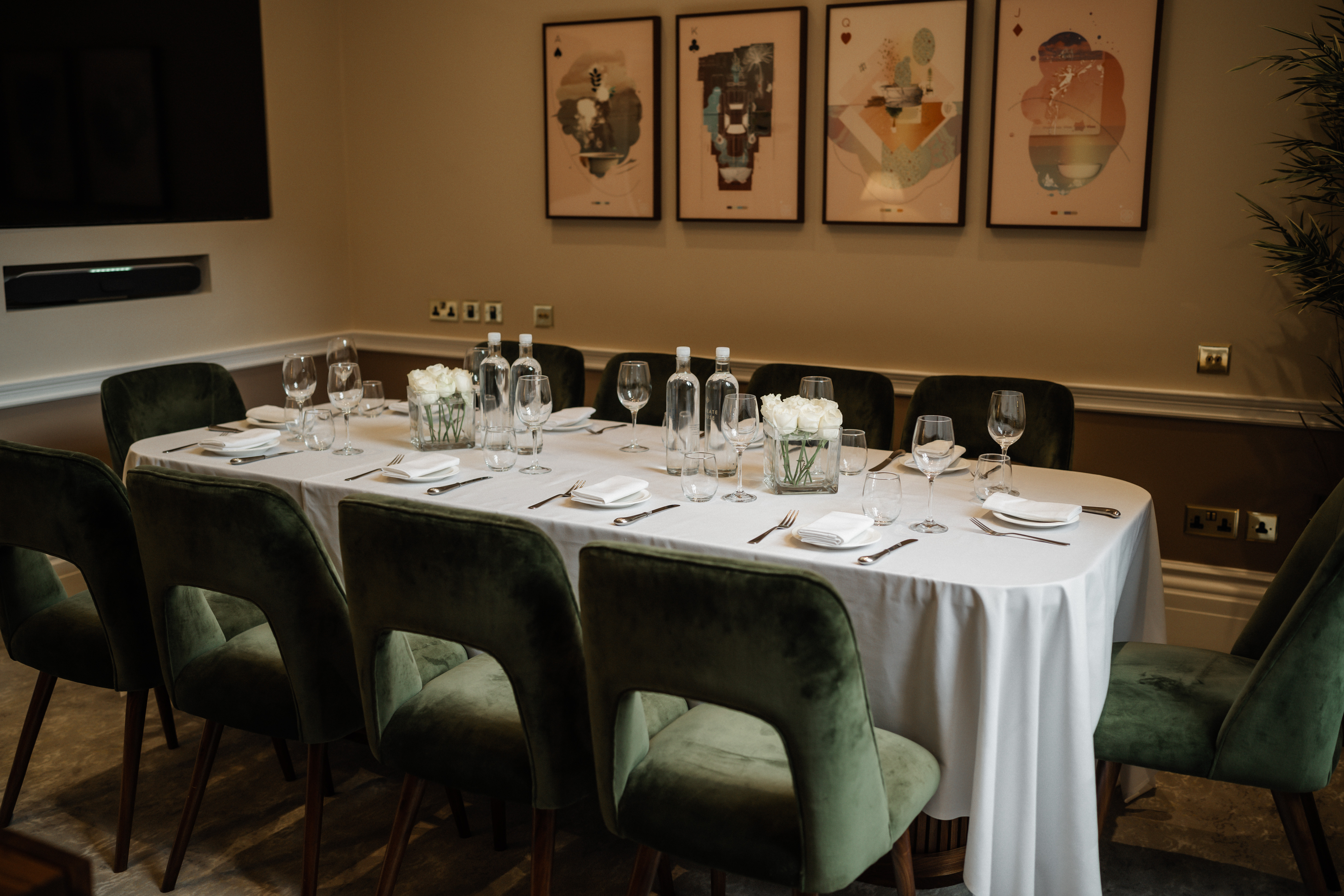 Elegant meeting space at Club Priv'e with long table, ideal for corporate events.