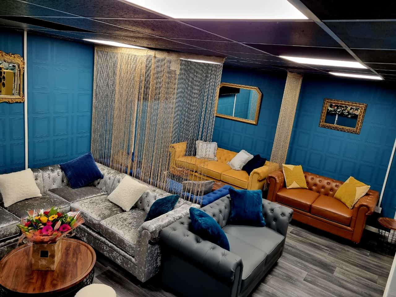 Stylish Al-Miski Lounge with blue walls, perfect for meetings and events.