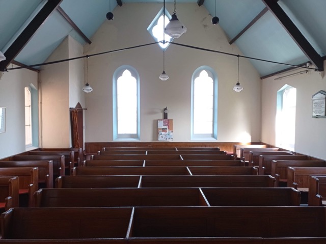 Ebenezer Chapel interior with wooden pews, ideal for community events and workshops.