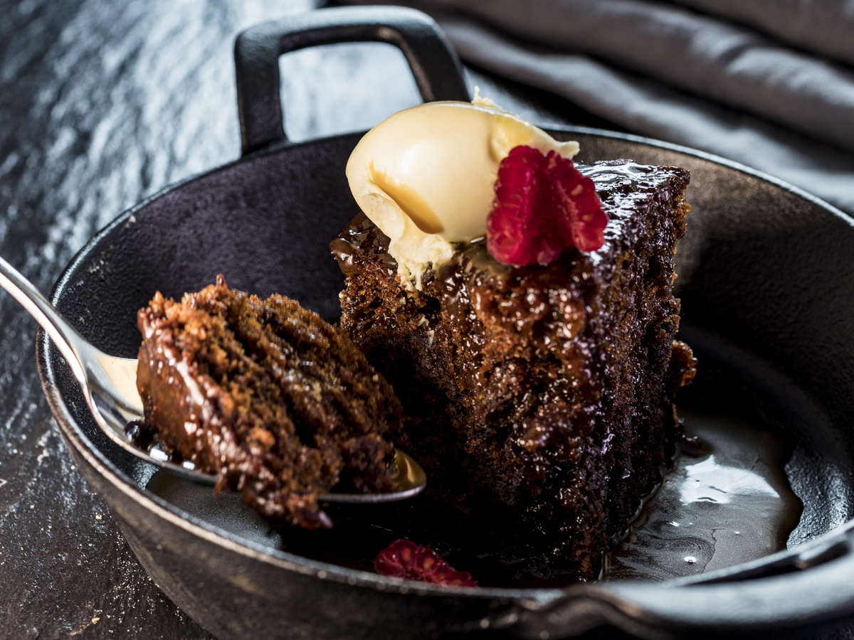 Decadent chocolate cake dessert with ice cream at Concorde Conference Centre event catering.