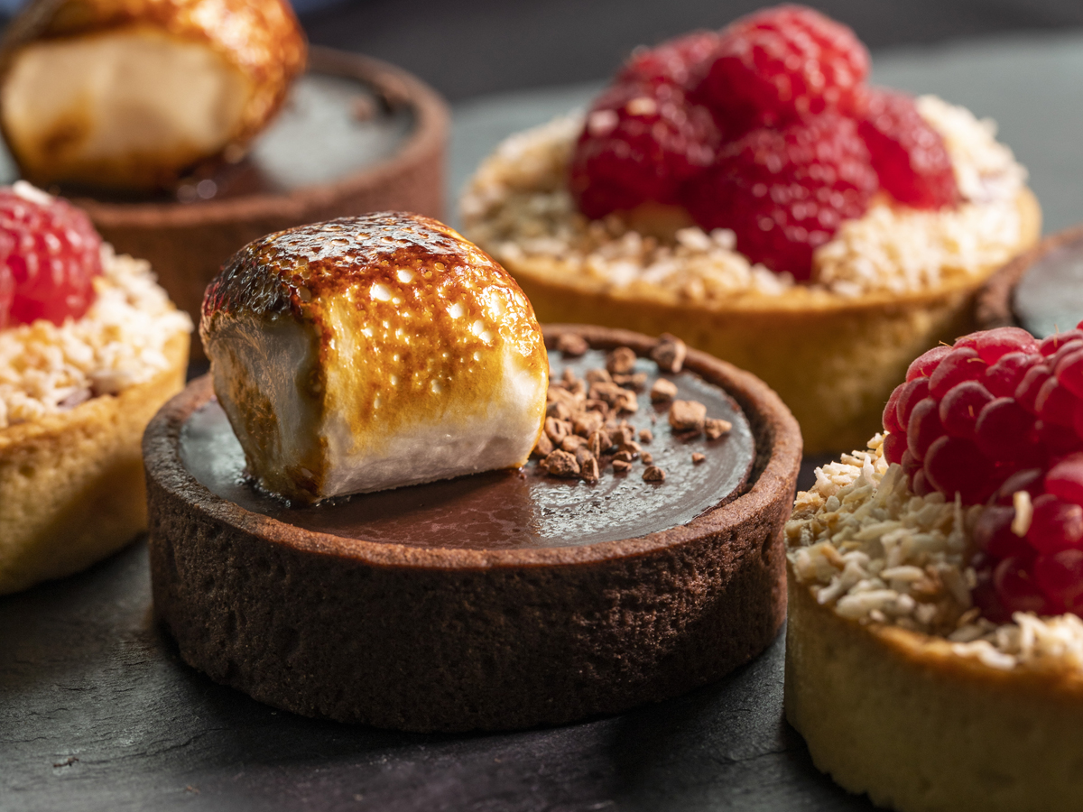 Gourmet chocolate tarts with meringue at Concorde Conference Centre event.