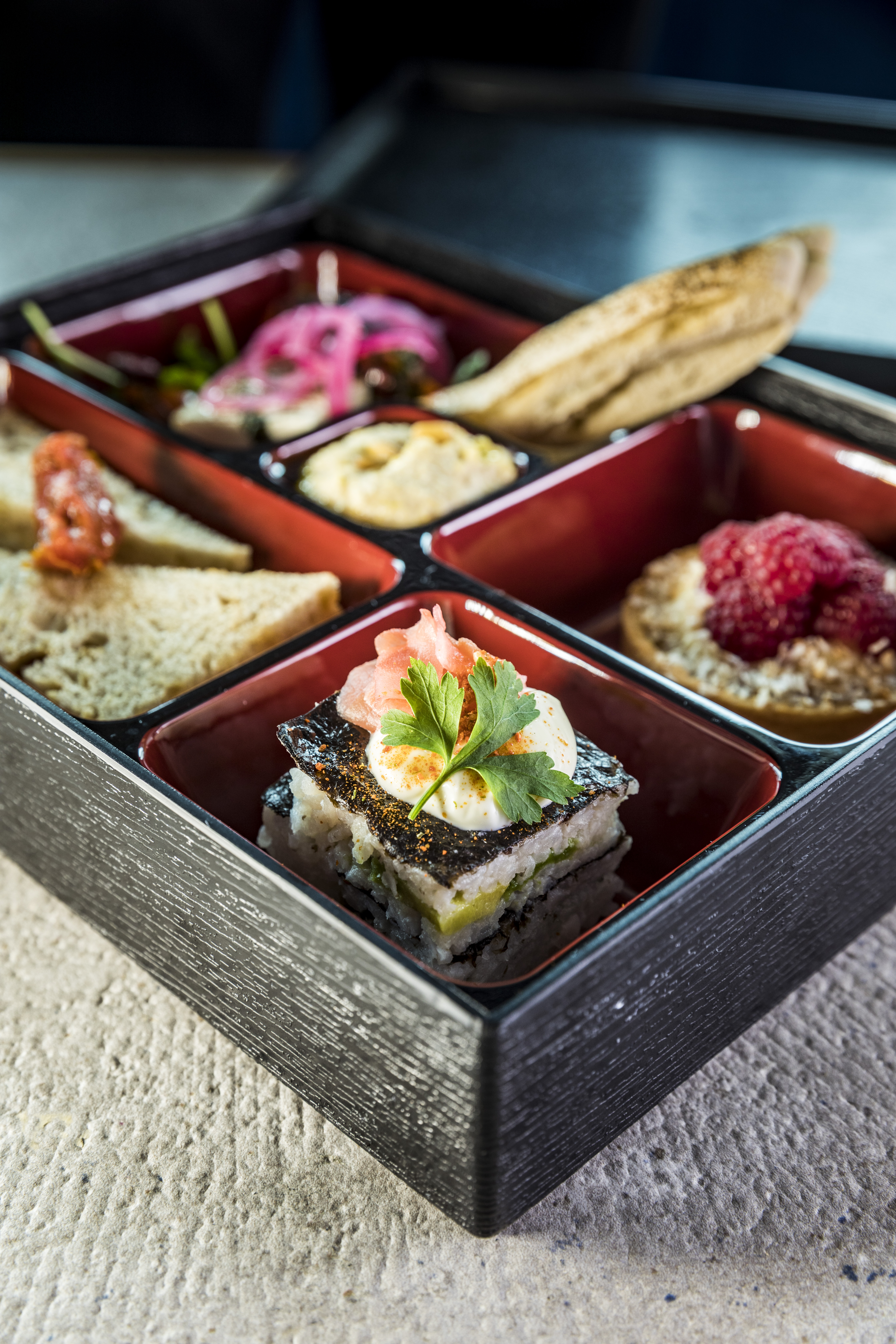 Gourmet bento box at Concorde Hangar for upscale networking lunches and events.
