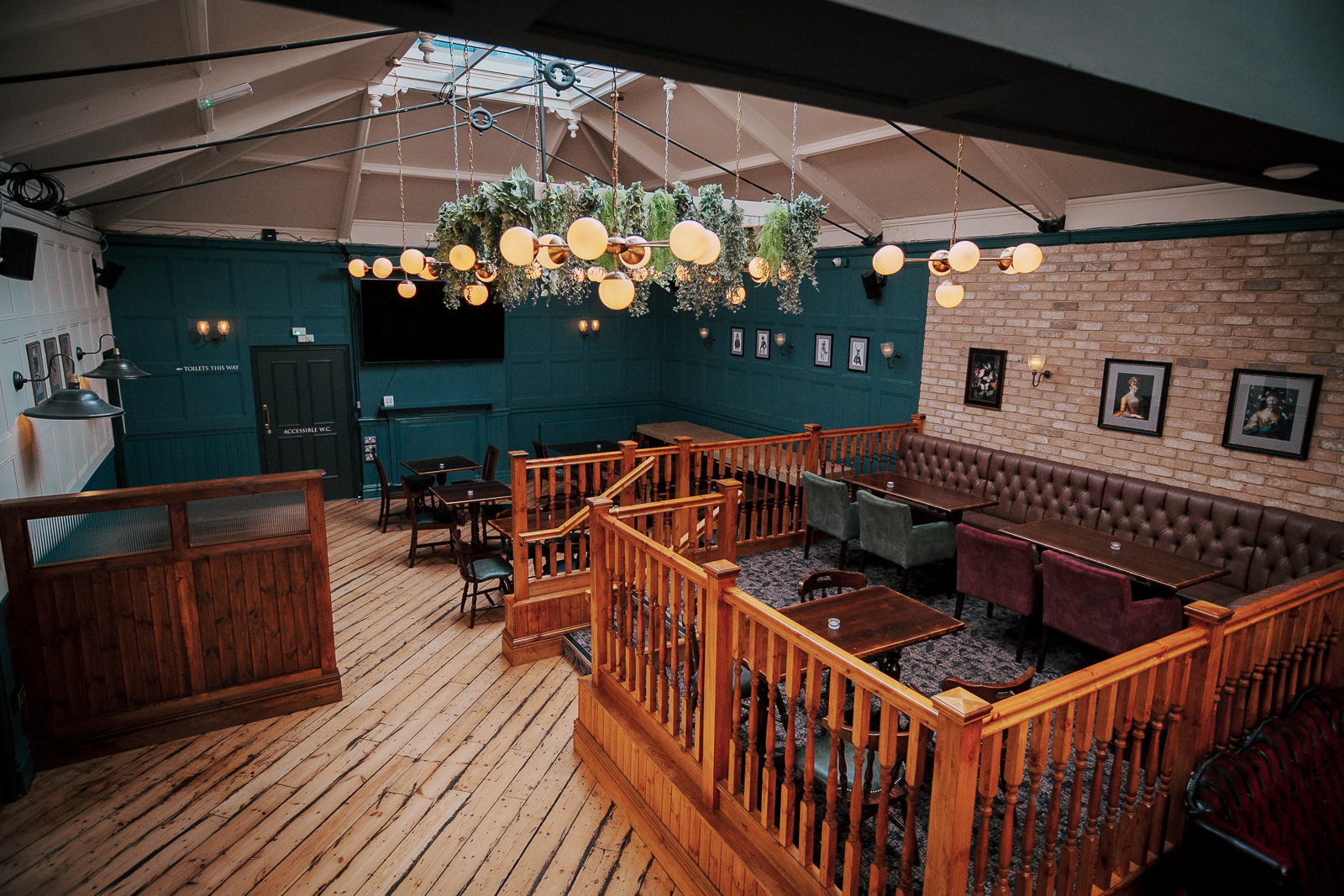 Three Compasses Pub with cozy seating, ideal for networking events and workshops.