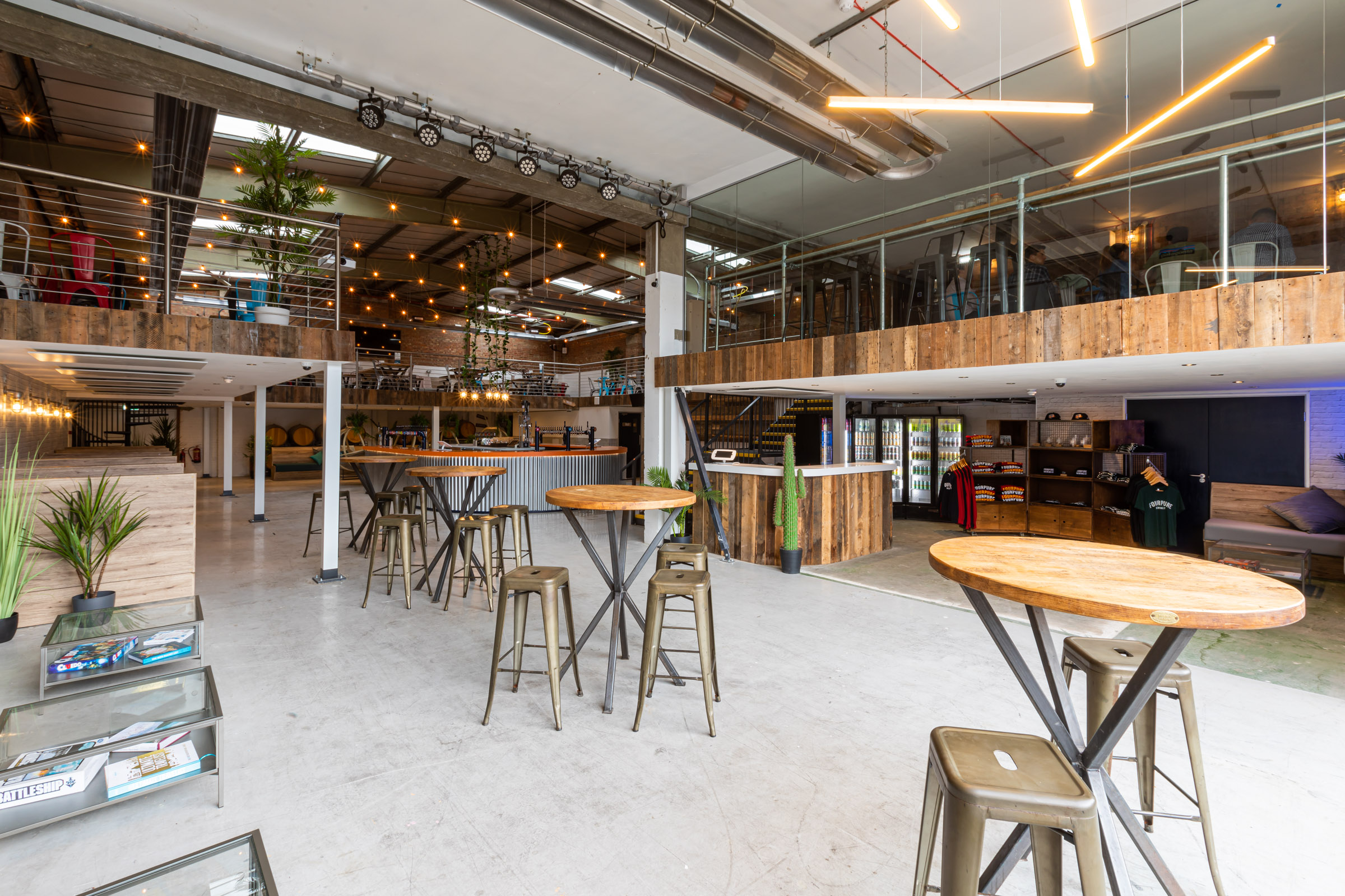 Versatile Fourpure Taproom event space with modern decor for corporate meetings and social gatherings.