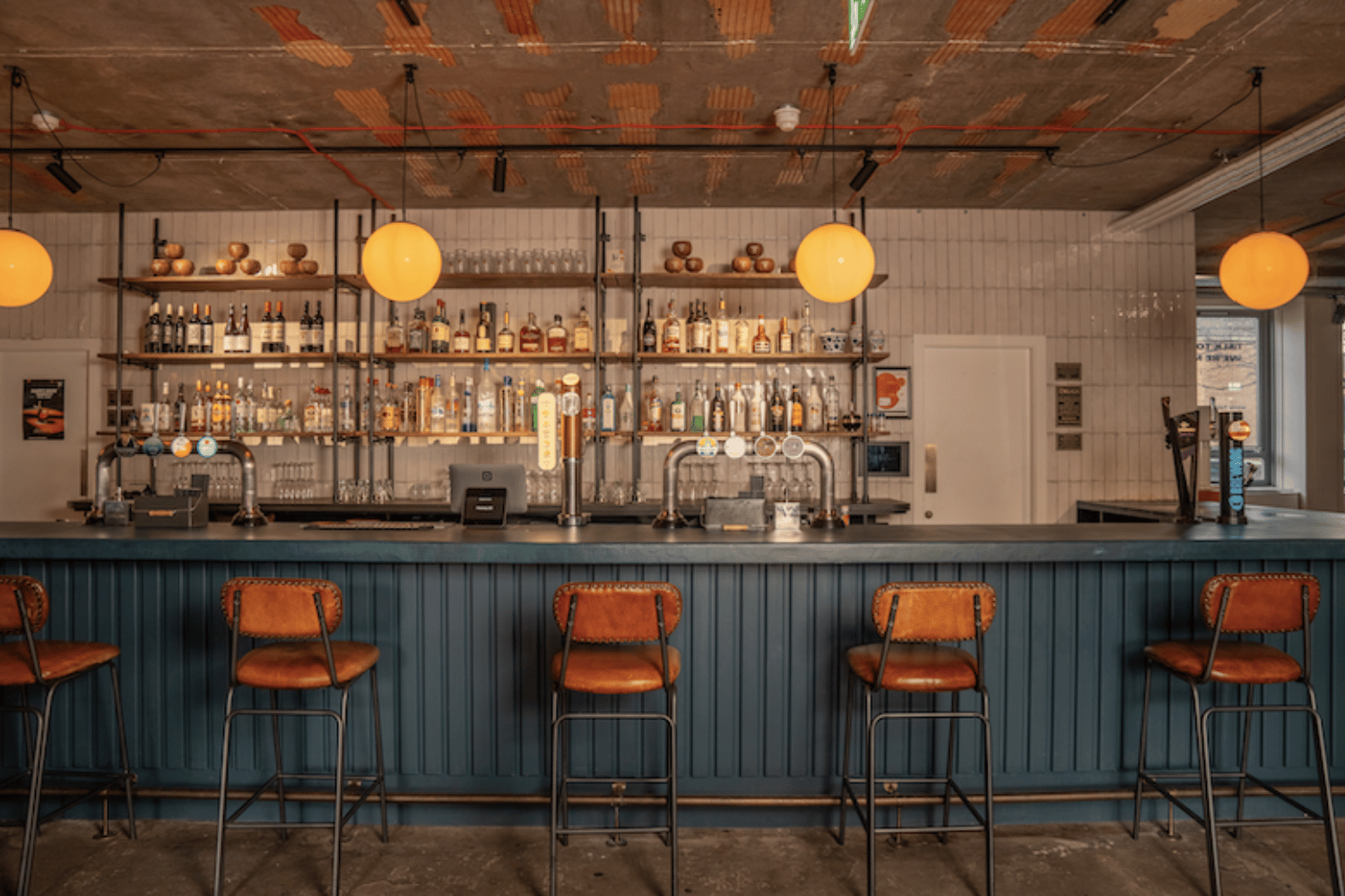 Stylish bar area at FACTORY 15, perfect for networking events and gatherings.