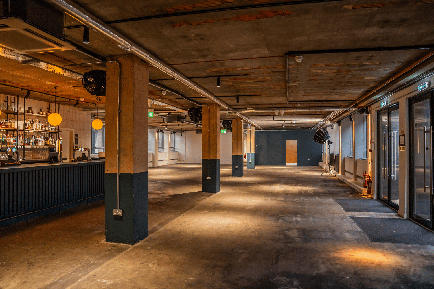 "FACTORY 15 Bar in Barking: industrial event space with flexible seating for gatherings."