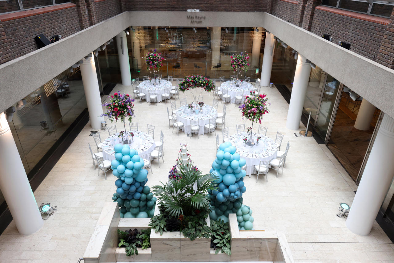 Max Rayne Atrium event space with elegant tables, ideal for weddings and corporate events.