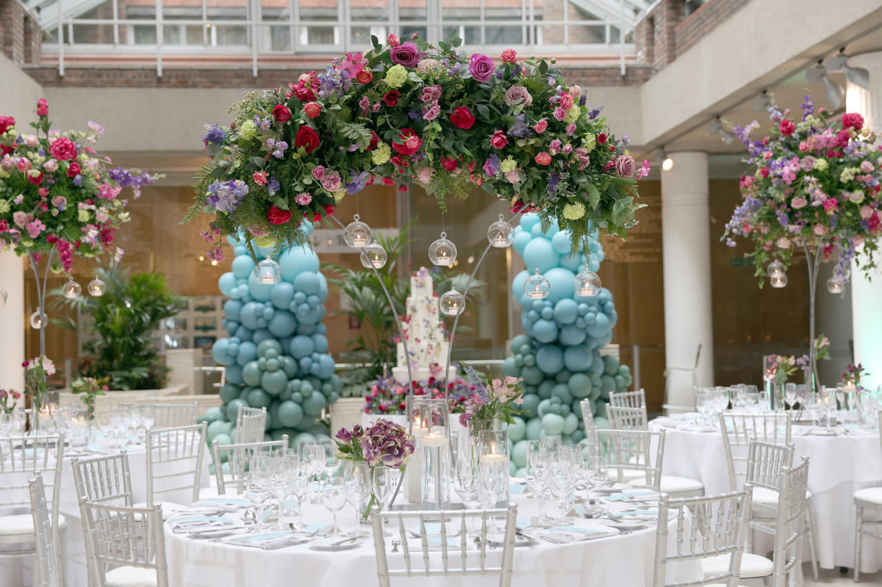 Max Rayne Atrium event space with floral arch, ideal for weddings and upscale gatherings.