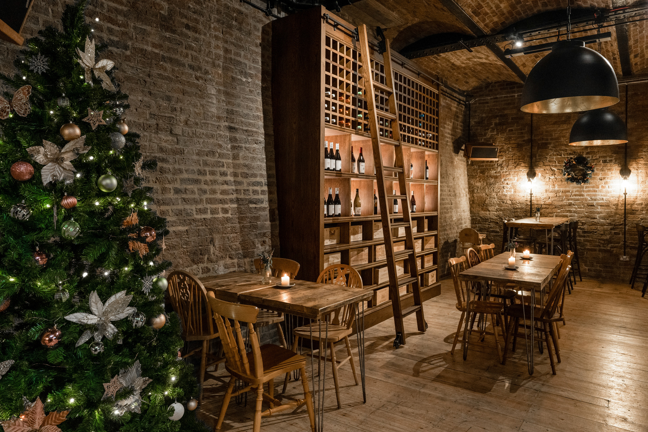 Cozy rustic dining room with exposed brick, ideal for holiday gatherings and wine tastings.