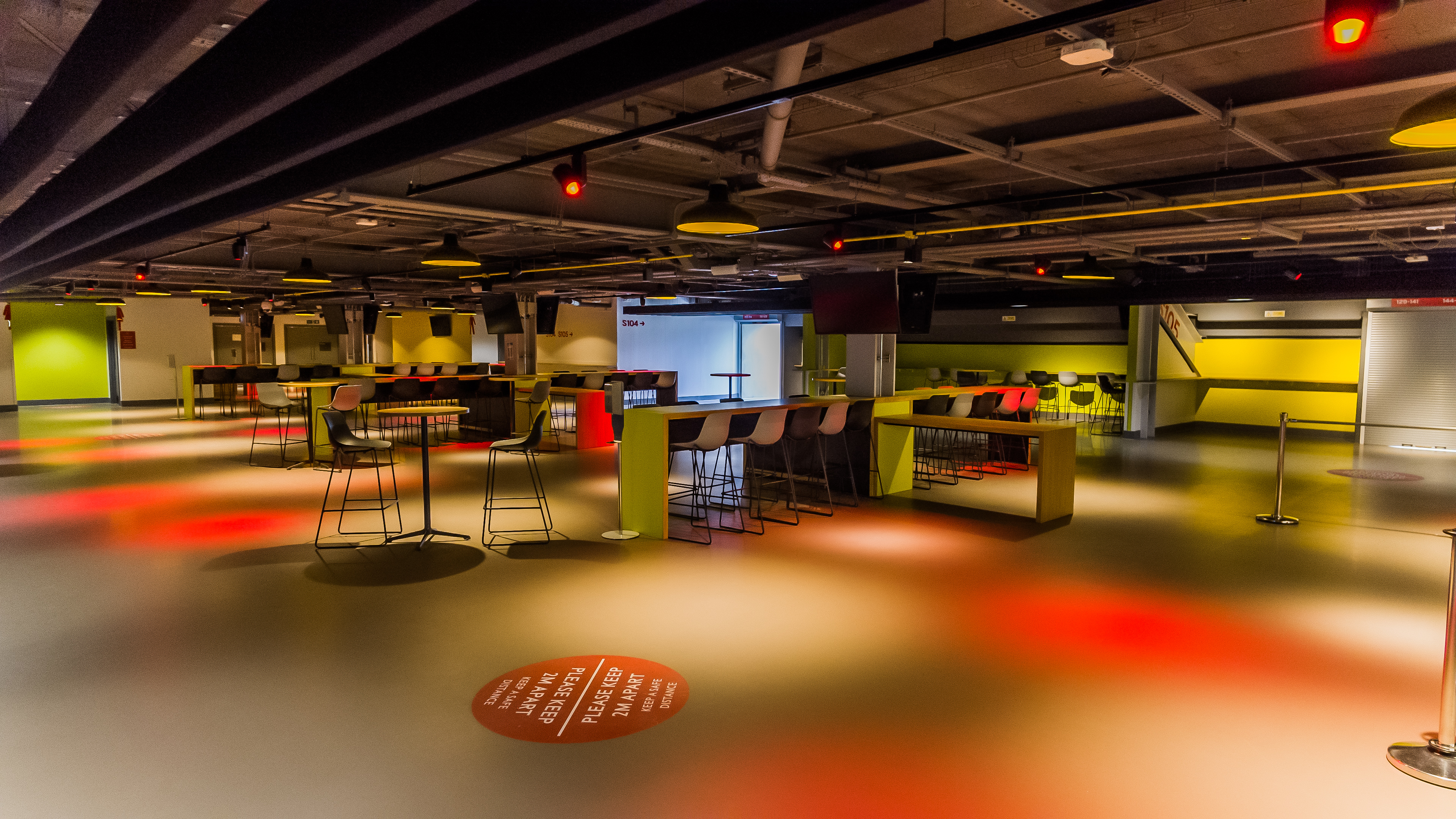 Modern event space at Brentford FC with flexible seating for networking and workshops.