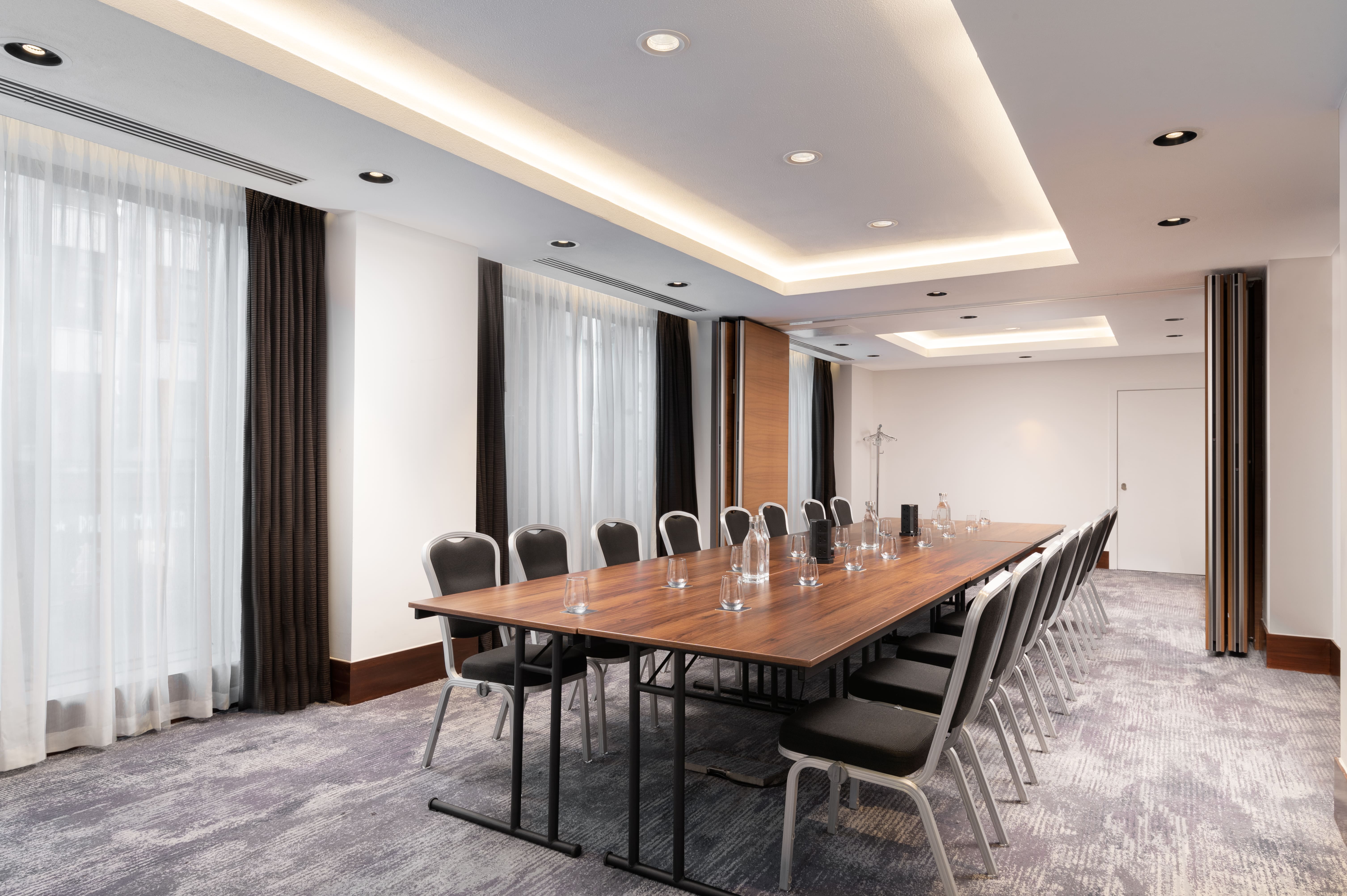 Modern Mezzanine Meeting Room at Hilton London Metropole, ideal for professional gatherings.
