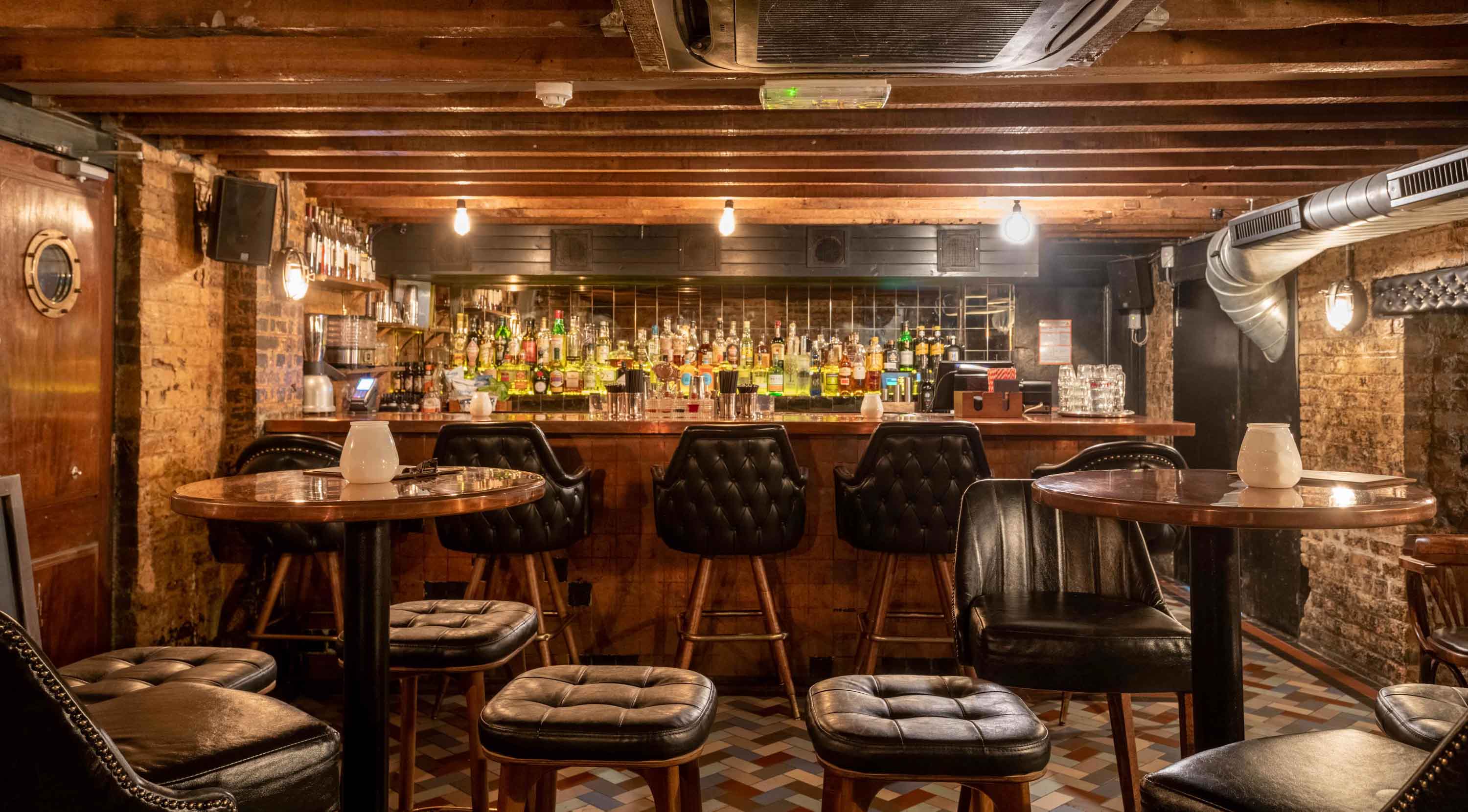 Intimate bar setting with rustic decor, ideal for networking events and gatherings.