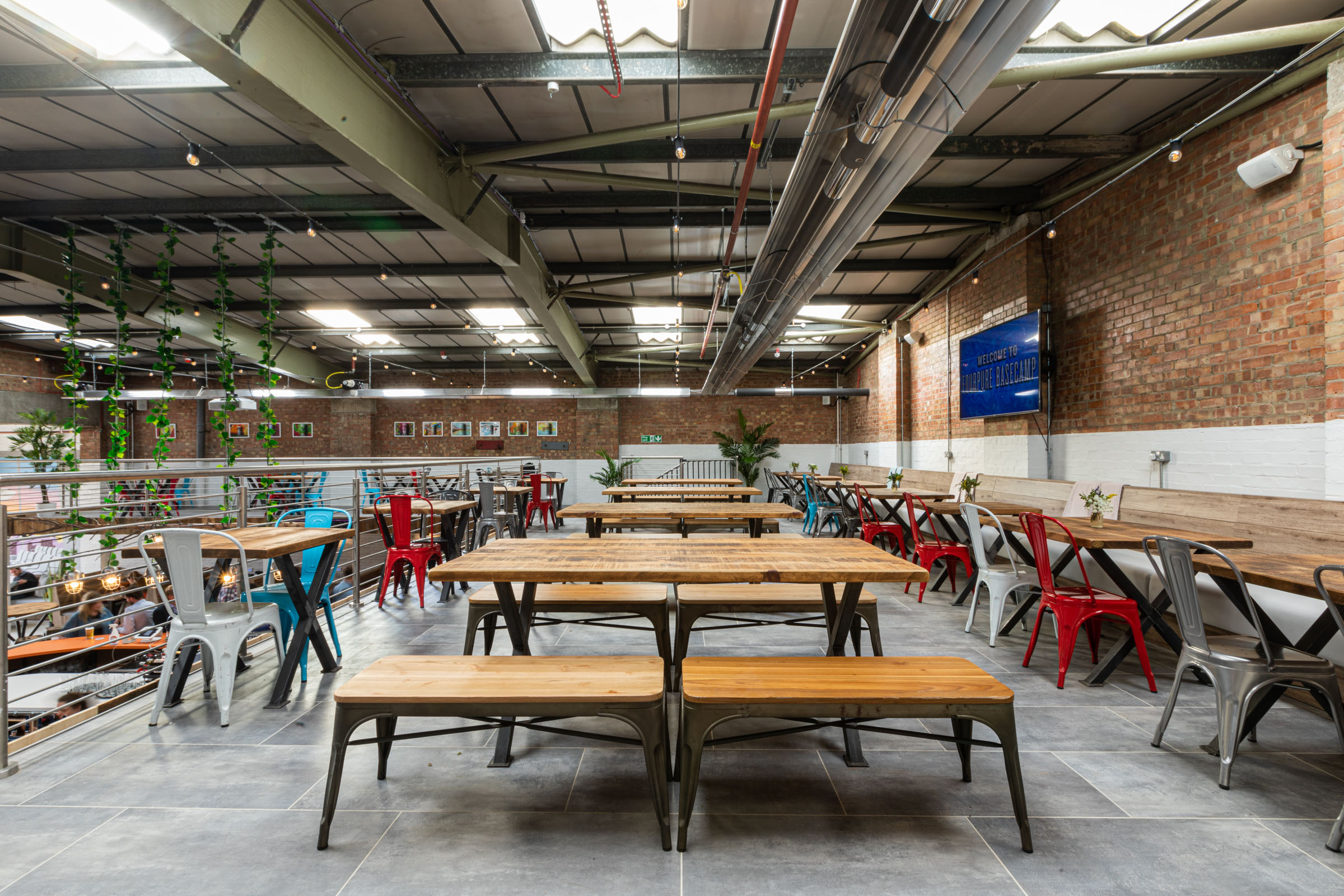 Versatile event space at Fourpure Taproom with industrial-chic design for networking.