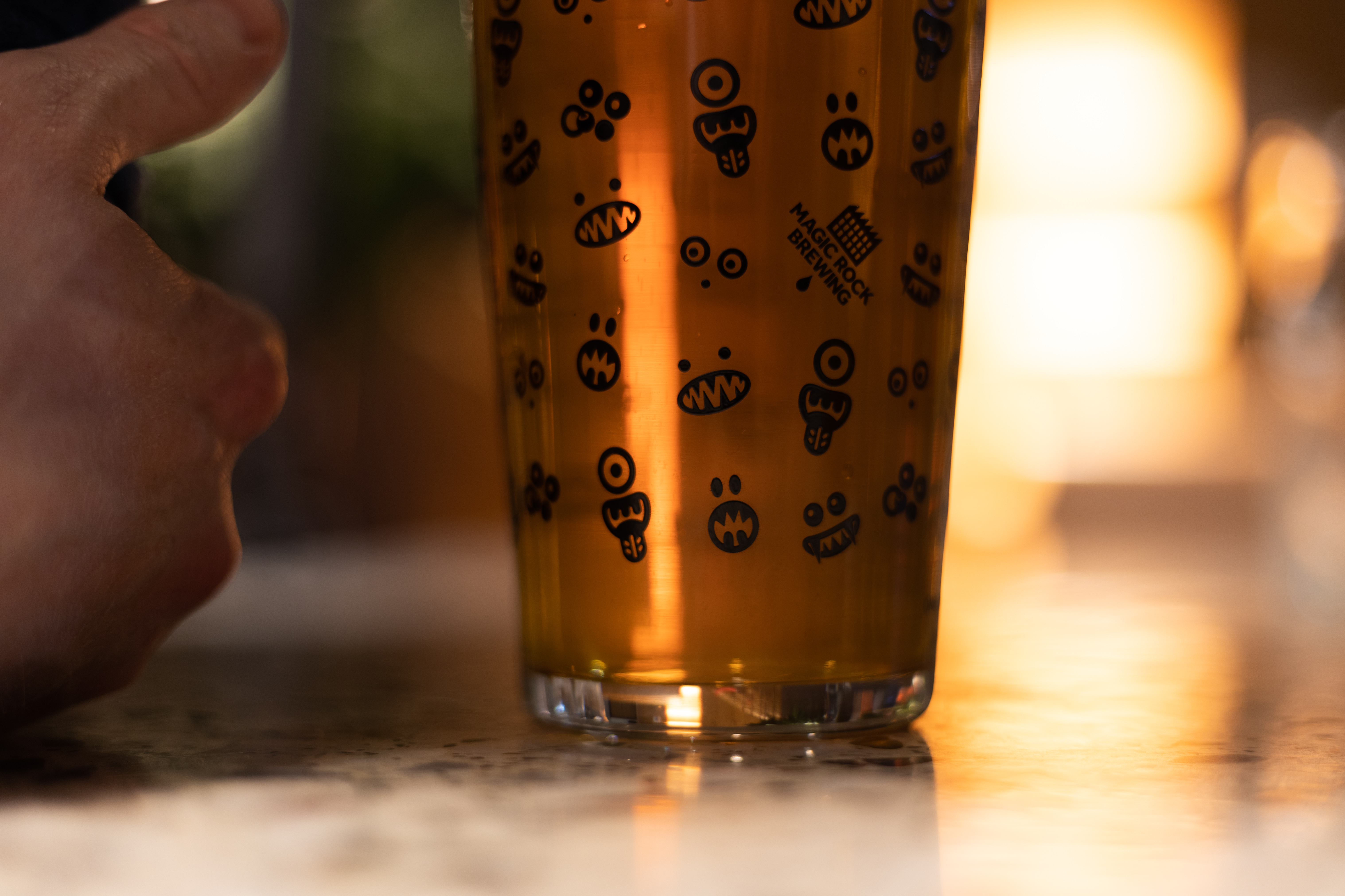 Pint glass with playful graphics at Babel Beerhouse for casual gatherings and themed parties.