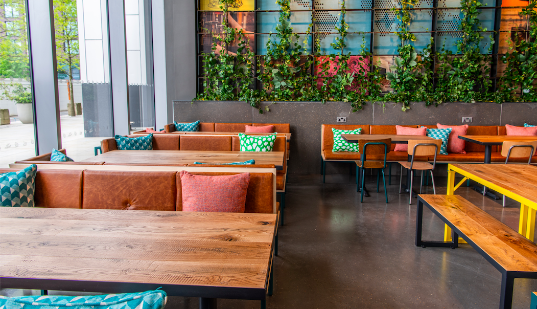 Vibrant event space at Babel Beerhouse with cozy seating for networking and meetings.