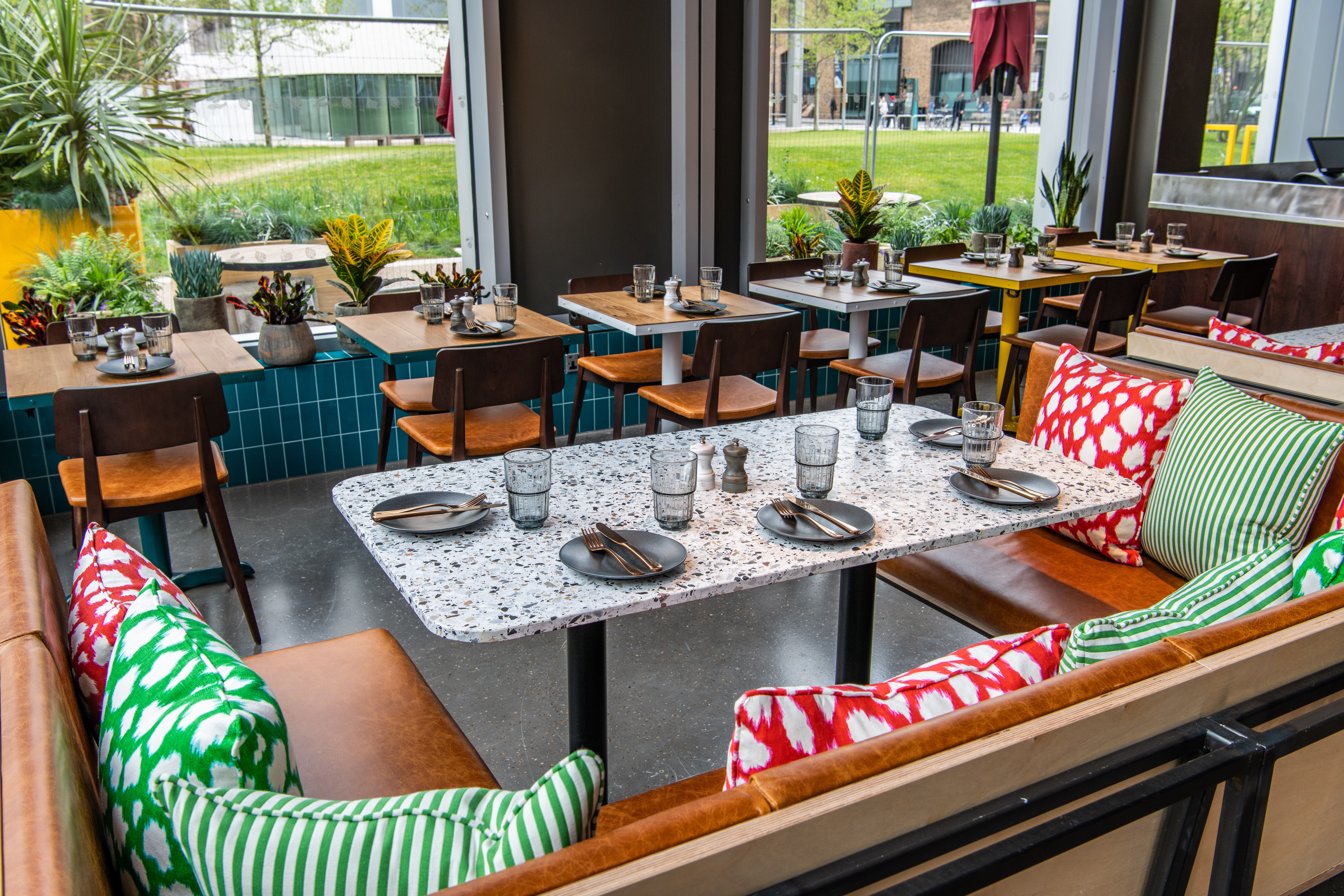 Vibrant dining space at Babel Beerhouse, ideal for meetings and events with stylish decor.
