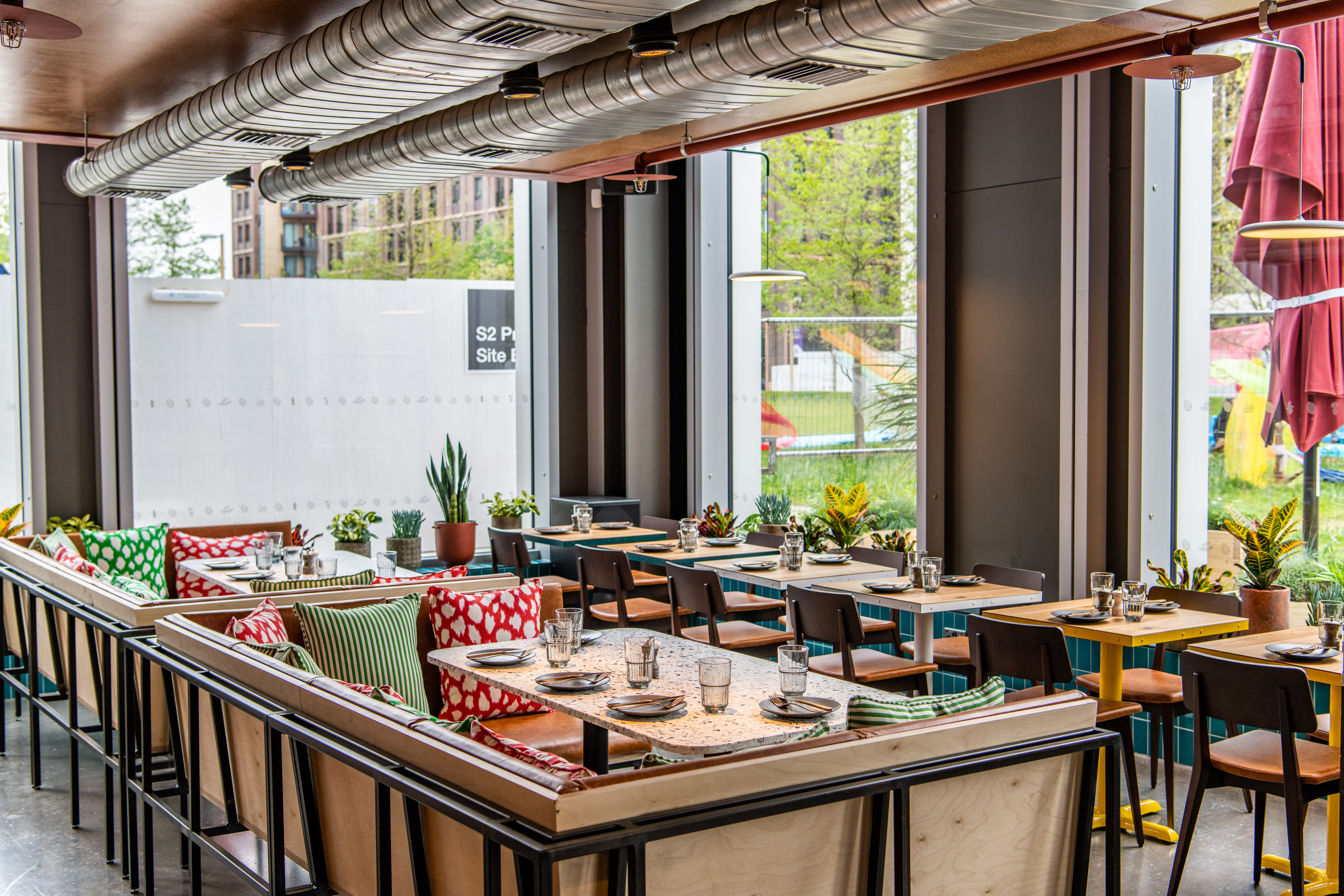 Modern dining space at Babel Beerhouse, ideal for meetings and events with natural light.