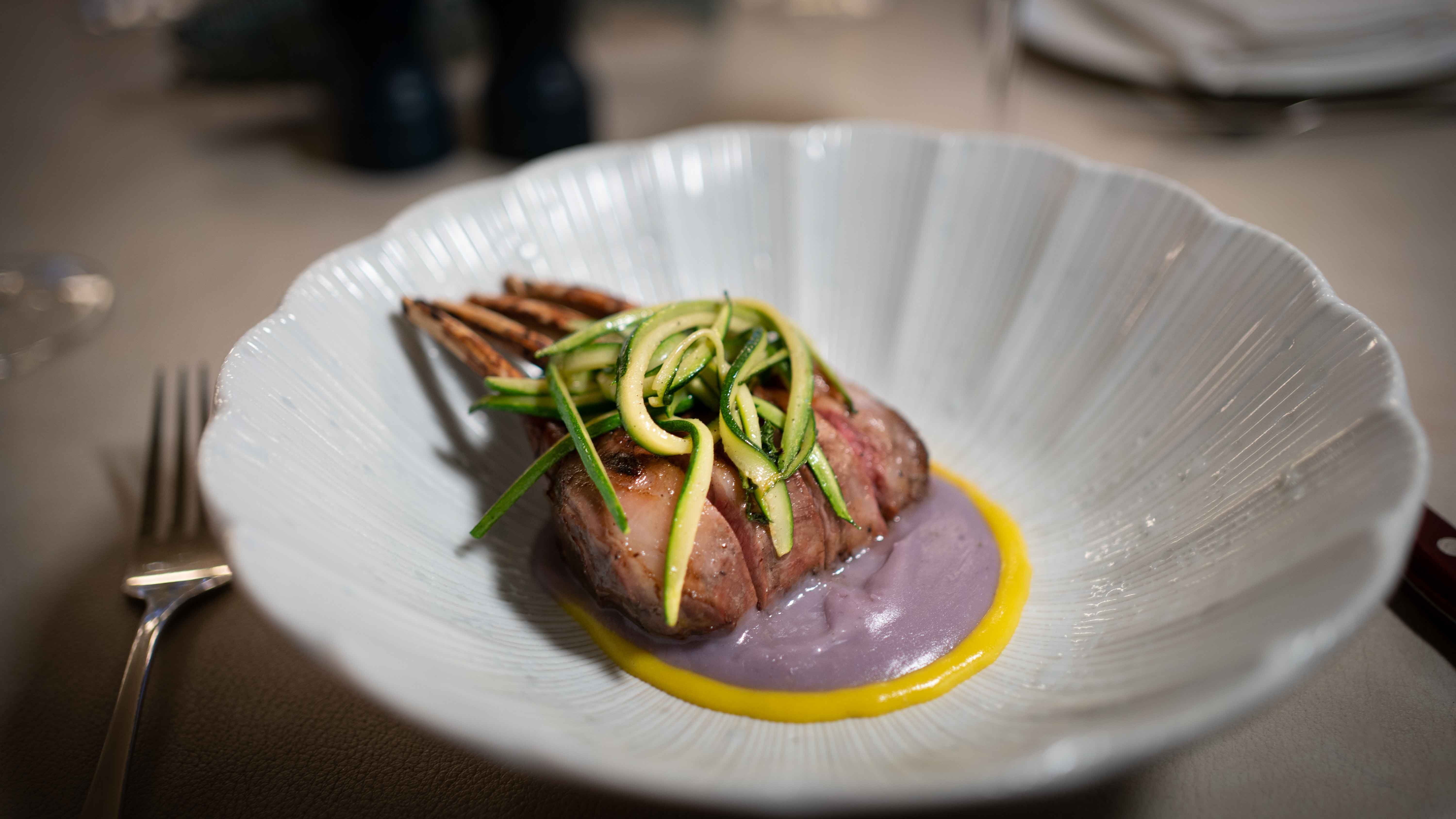 Elegant meat dish with vegetables at Casa Matilde event venue. Culinary artistry showcased.