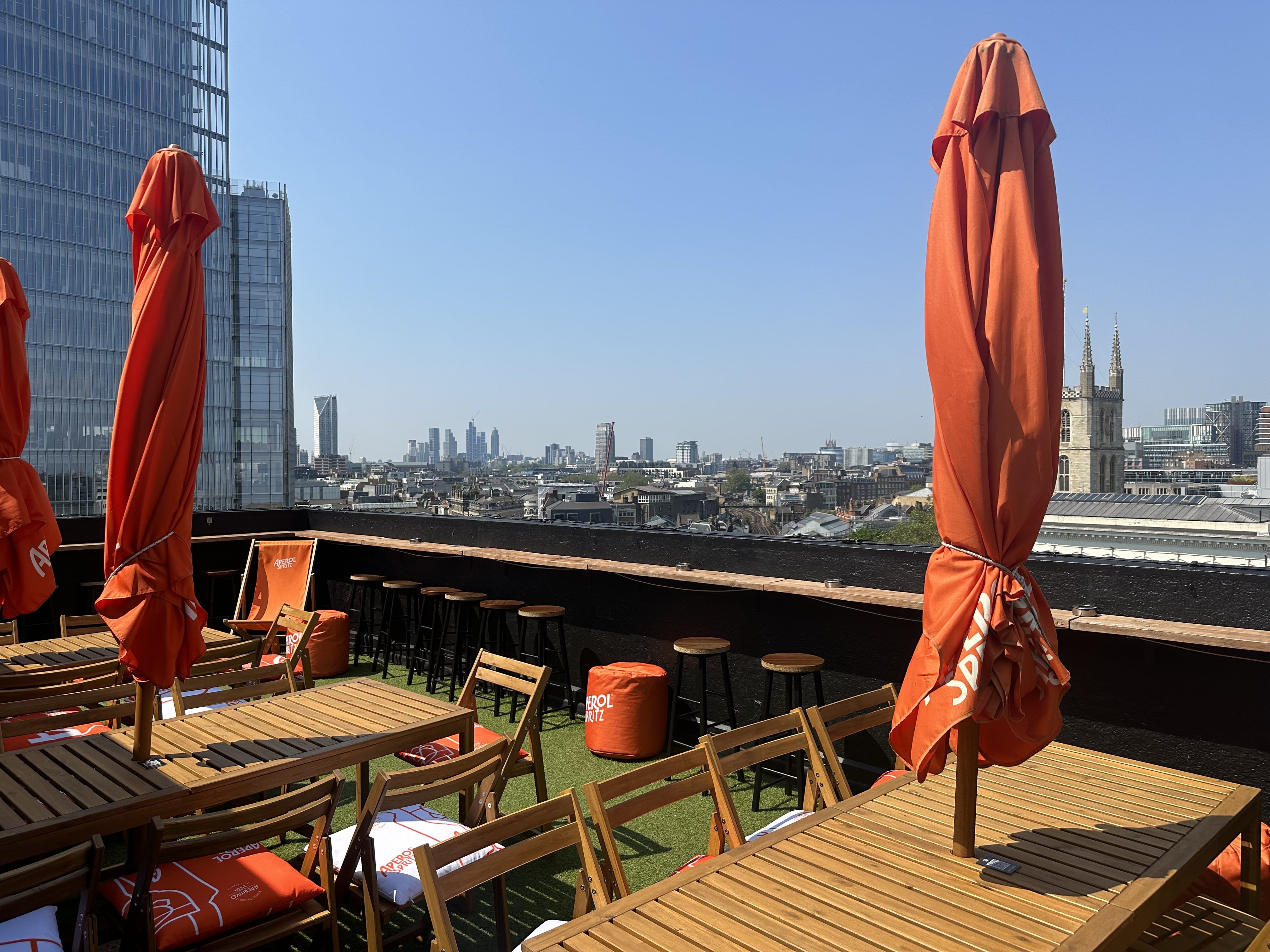 London Bridge Rooftop venue with stylish furniture and skyline, ideal for outdoor events.