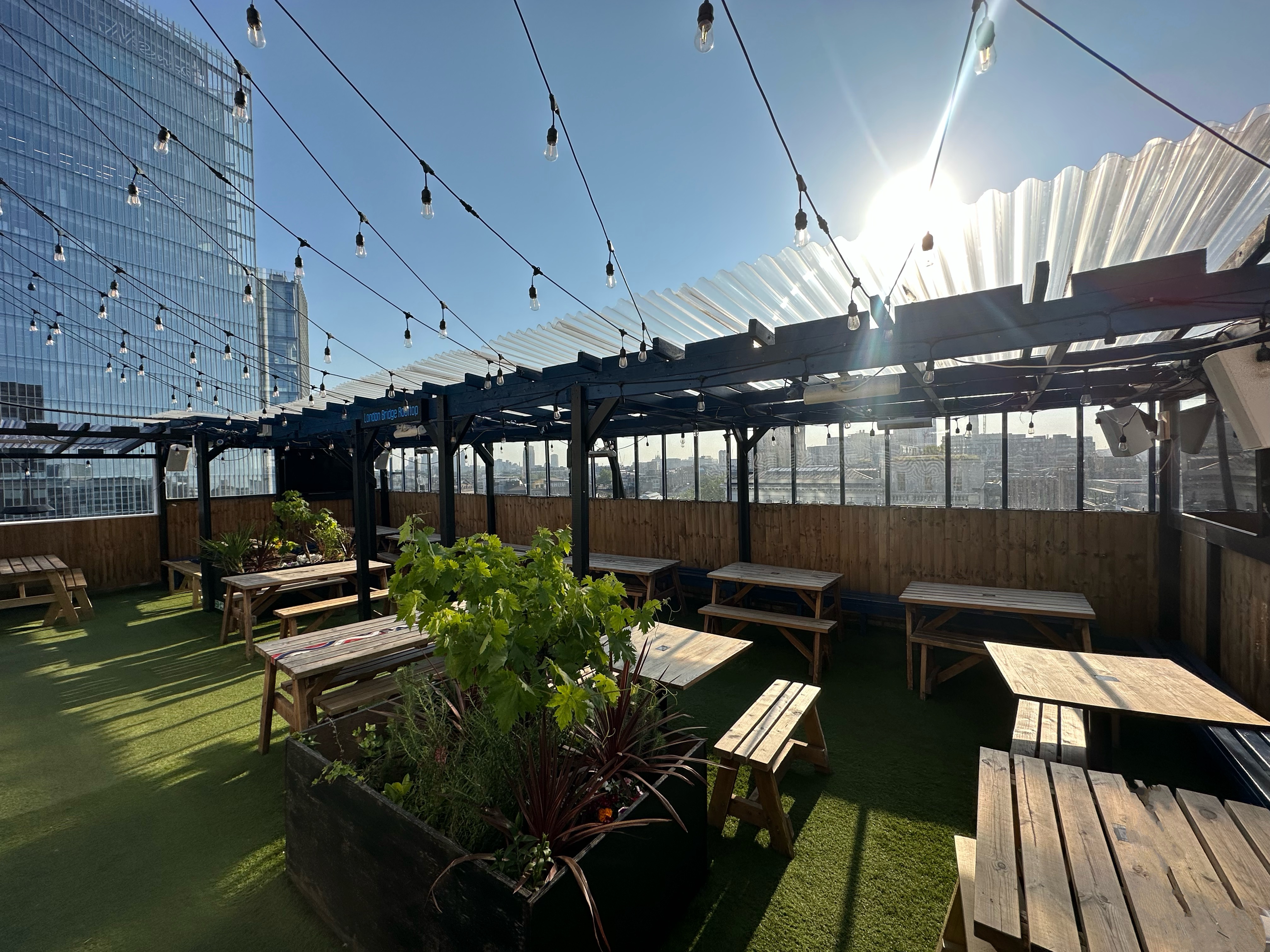 London Bridge Rooftop venue with string lights, ideal for events and celebrations.