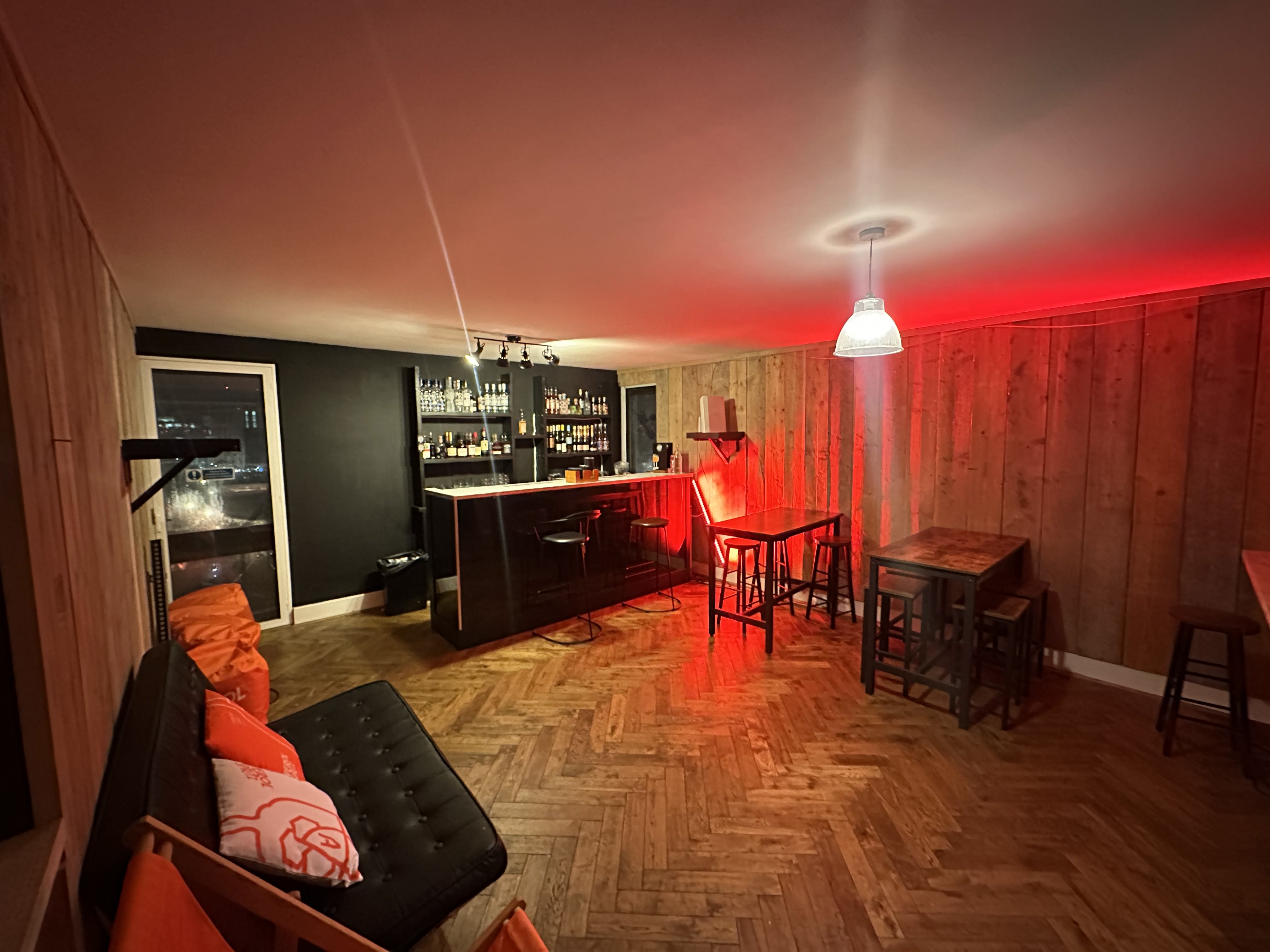 Stylish London Bridge Rooftop bar with warm wood accents, ideal for networking events.