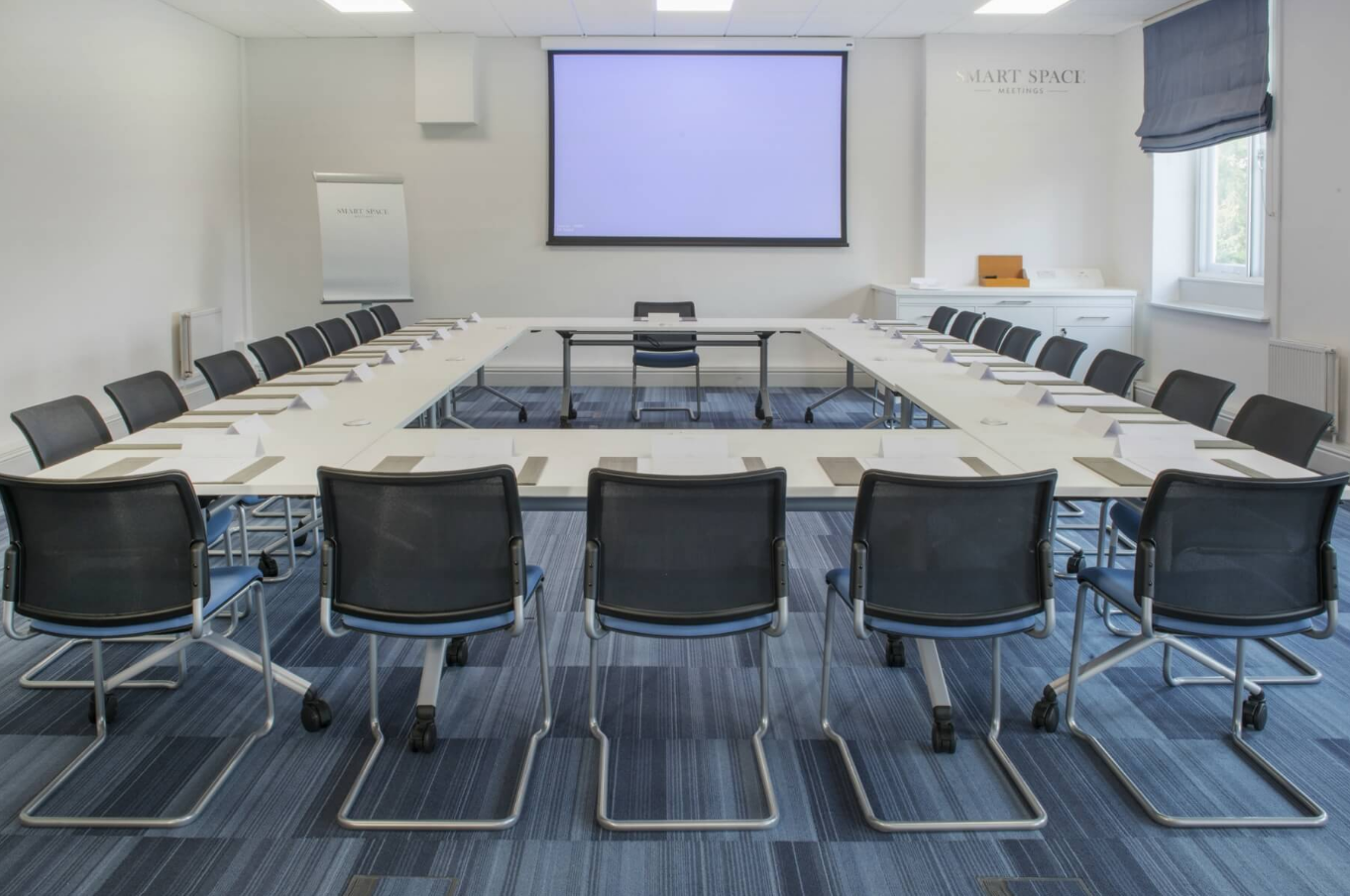 U-shaped meeting room at De Vere Beaumont Estate, ideal for workshops and strategic planning.