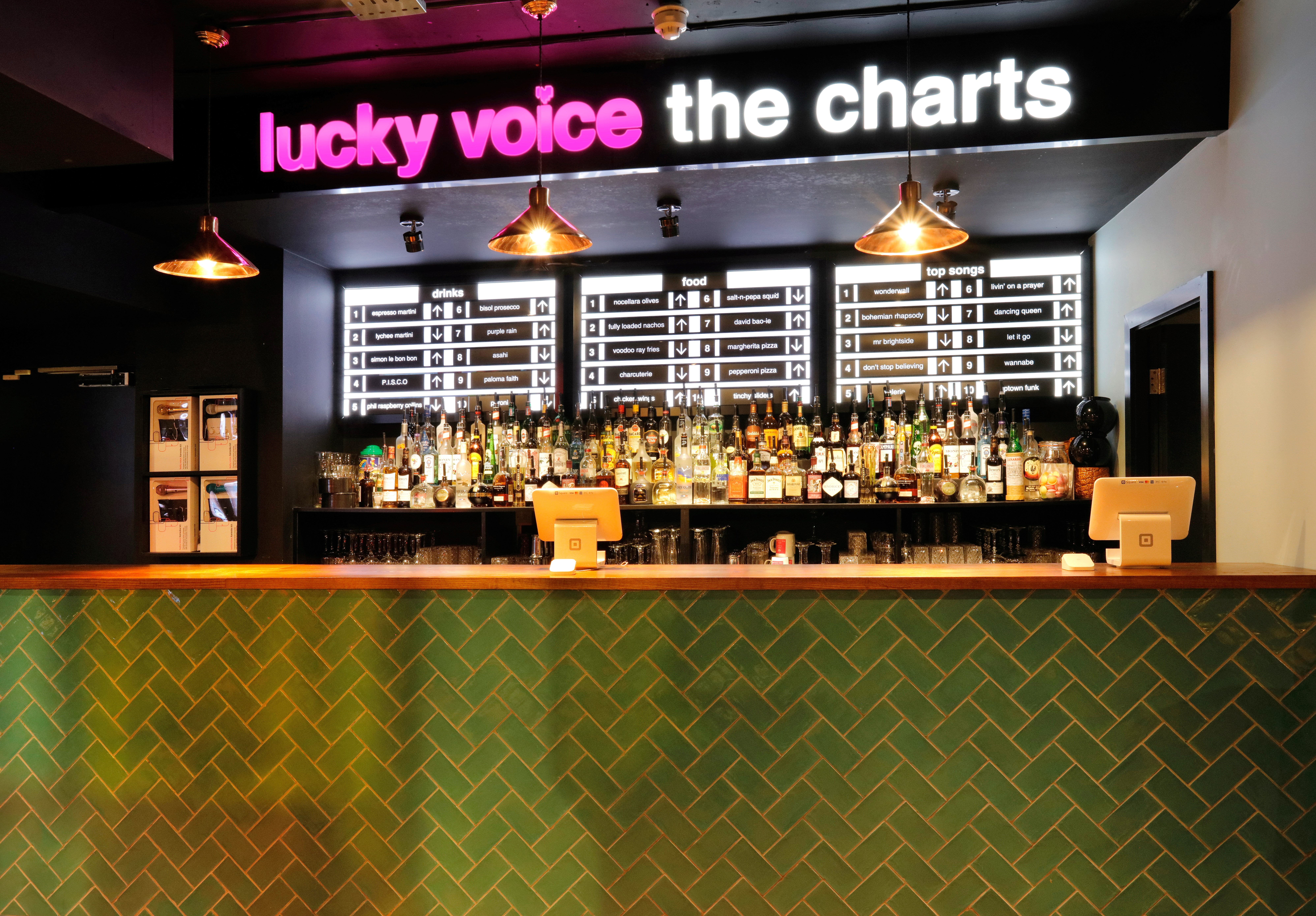 Vibrant bar area at Lucky Voice Holborn, ideal for team-building and networking events.