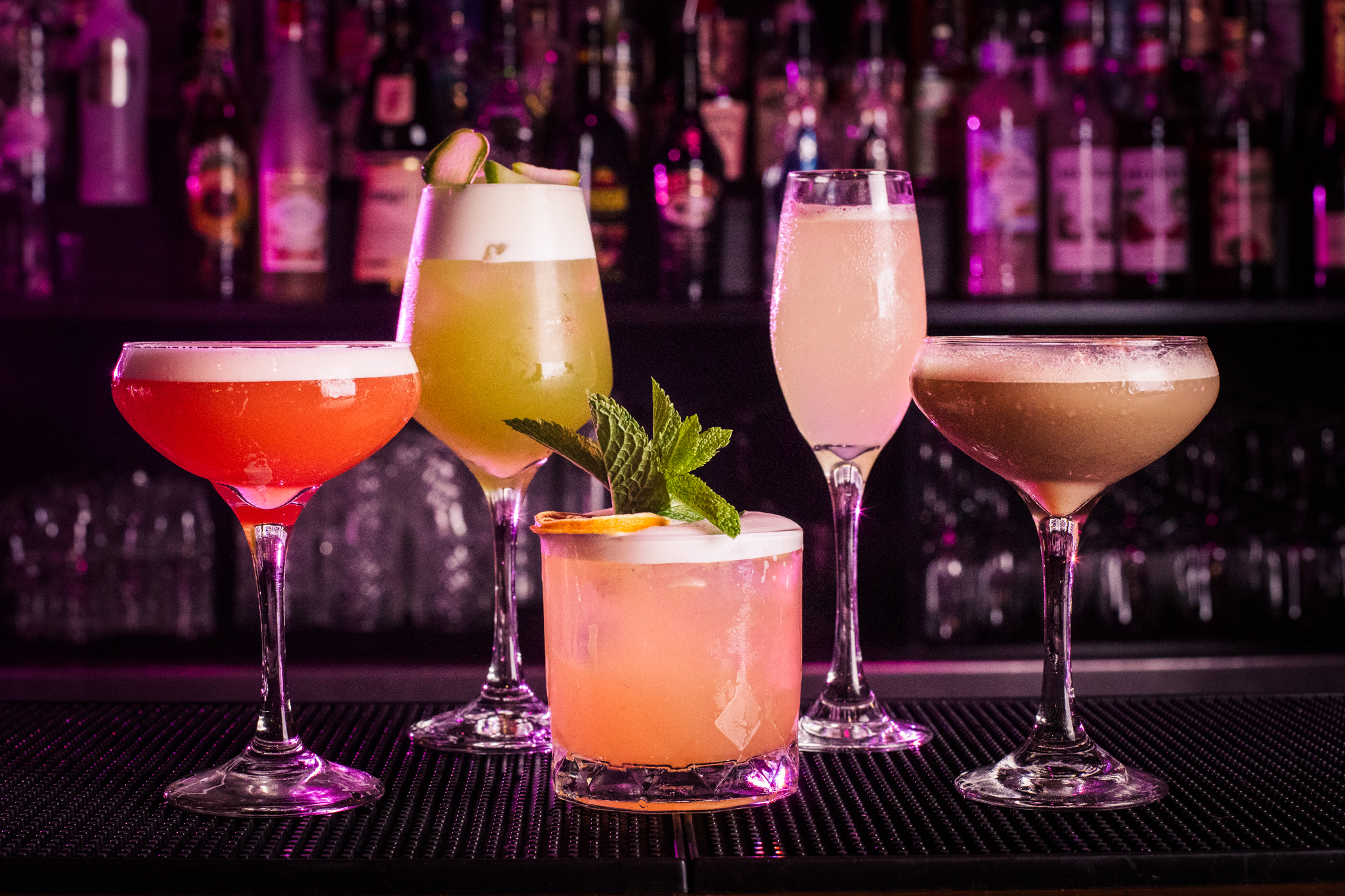 Vibrant cocktails in elegant glassware for sophisticated cocktail receptions.