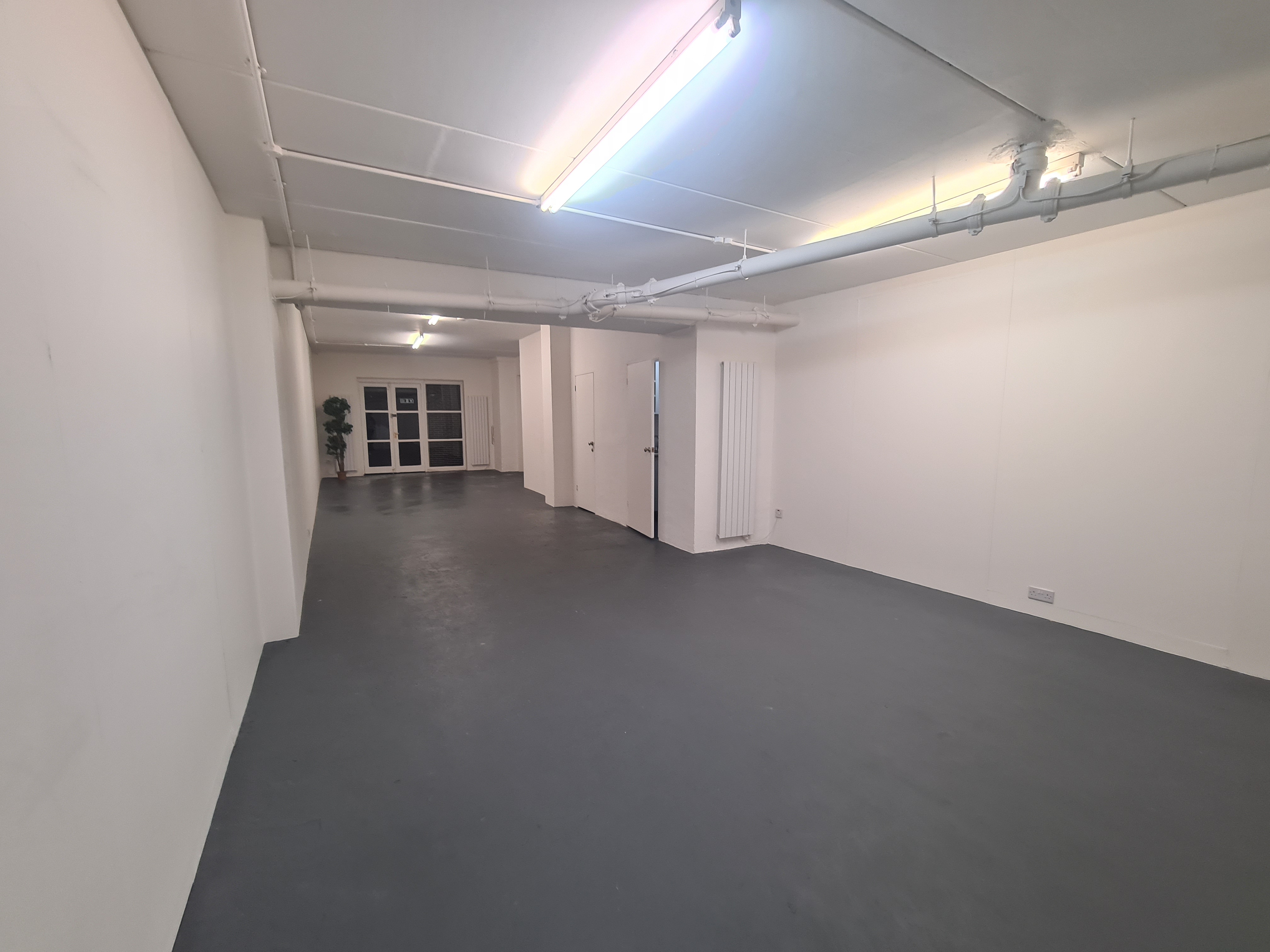 Large Gallery Room at B. T. Batsford: versatile event space with natural light for meetings.
