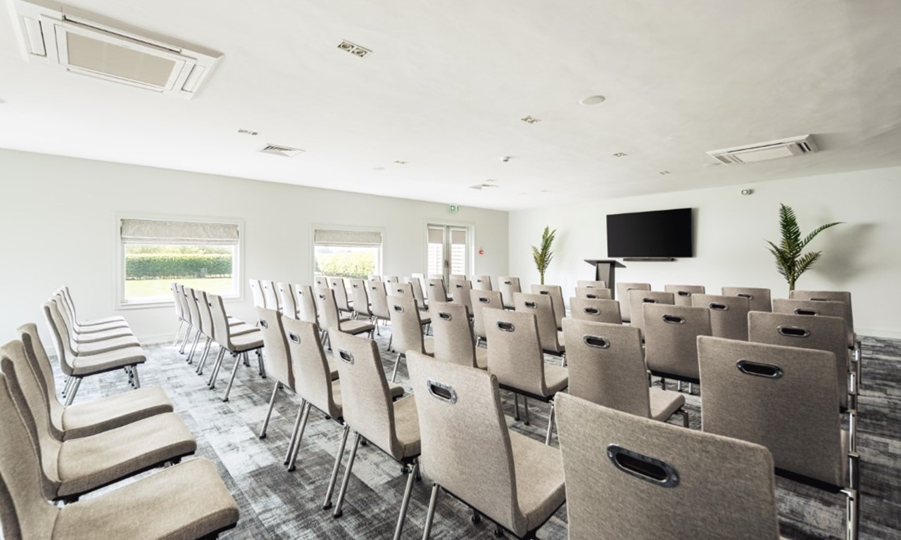 The Waterfront Hotel meeting space with chairs, ideal for corporate events and workshops.