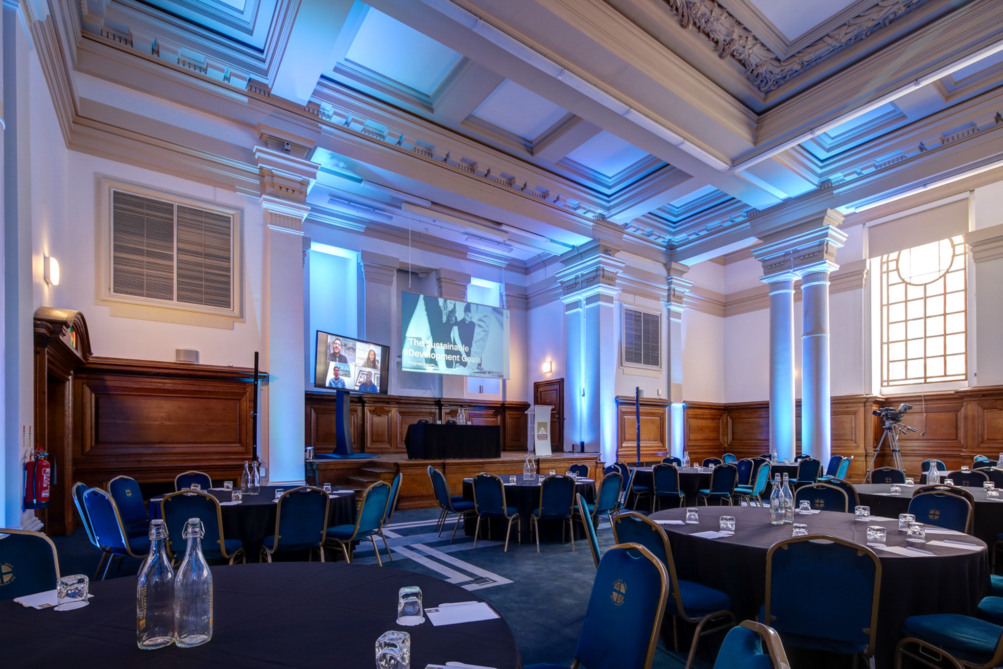 Lecture Hall in Central Hall Westminster with round tables, ideal for corporate meetings and conferences.