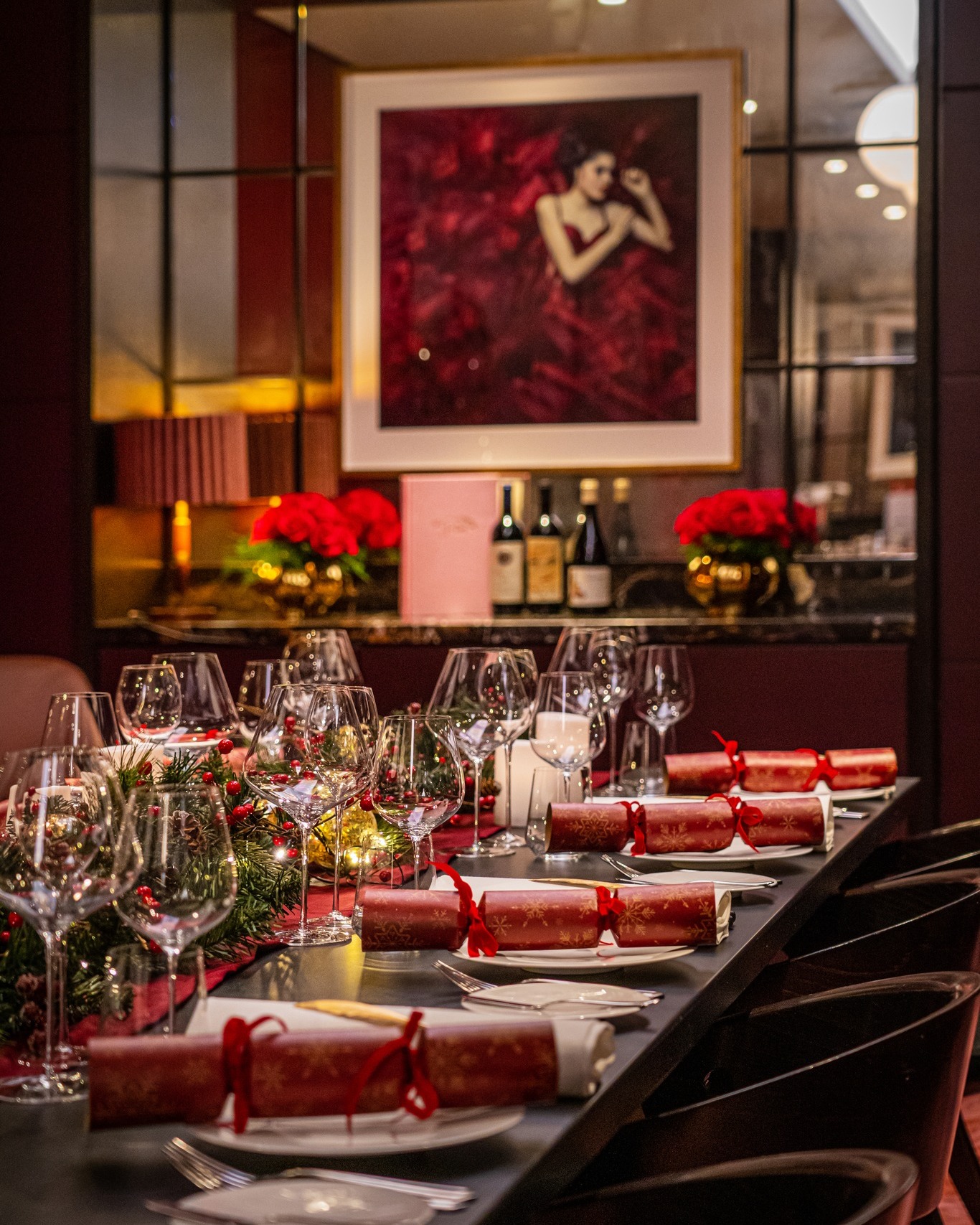 Elegant event setup in The Harben Room, featuring striking artwork and floral arrangements.