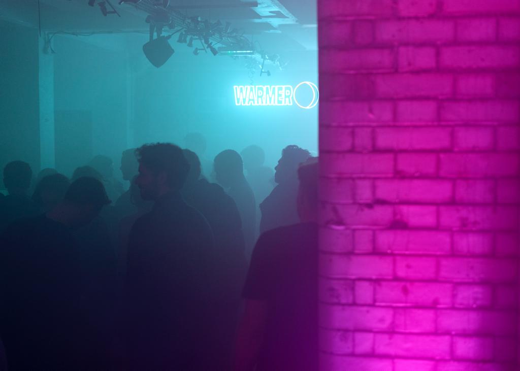 Vibrant event space at The Toilet Club with colorful lighting for networking gatherings.