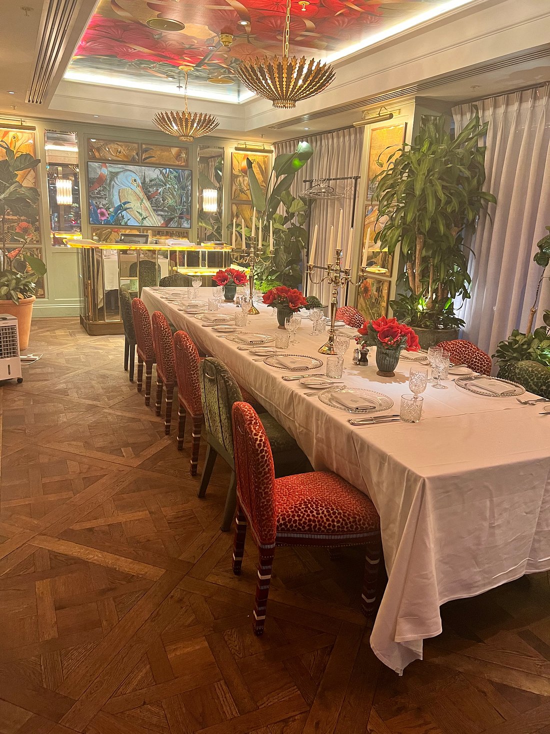 Elegant dining table with floral centerpieces in The Pelican Room, Ivy Victoria event space.