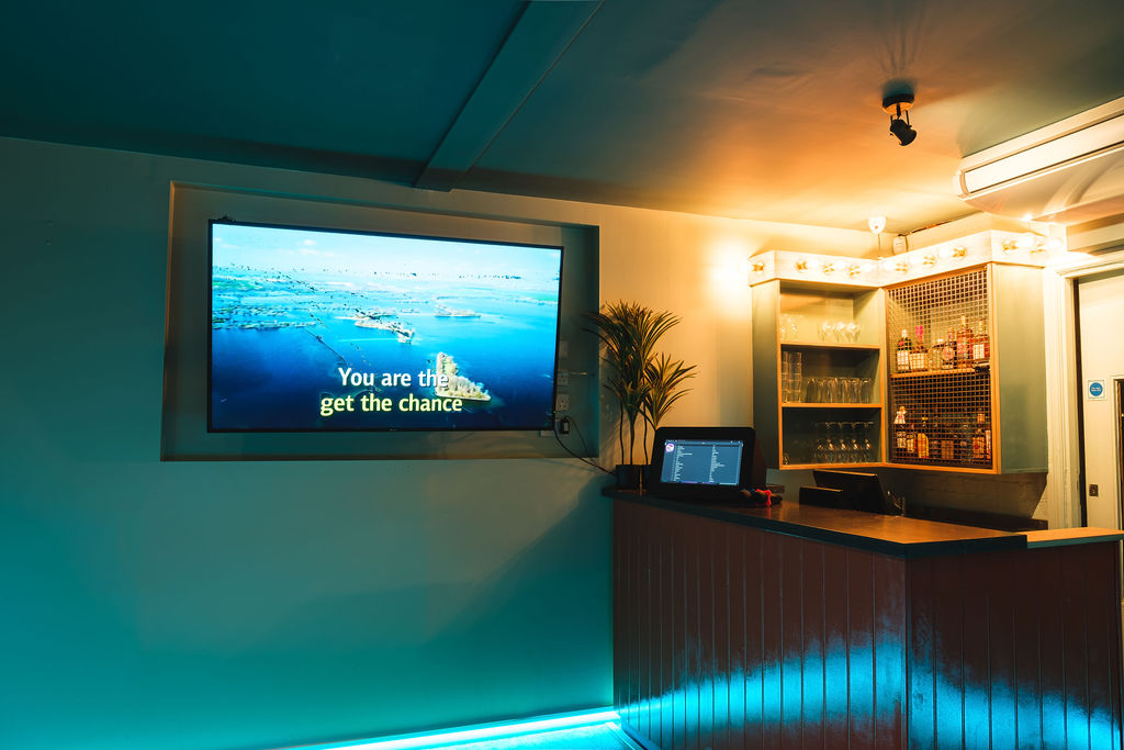 Modern event space with sleek bar, ideal for networking and gatherings in Liverpool.