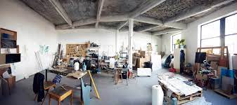 Spacious industrial venue with high ceilings, perfect for creative workshops and events.