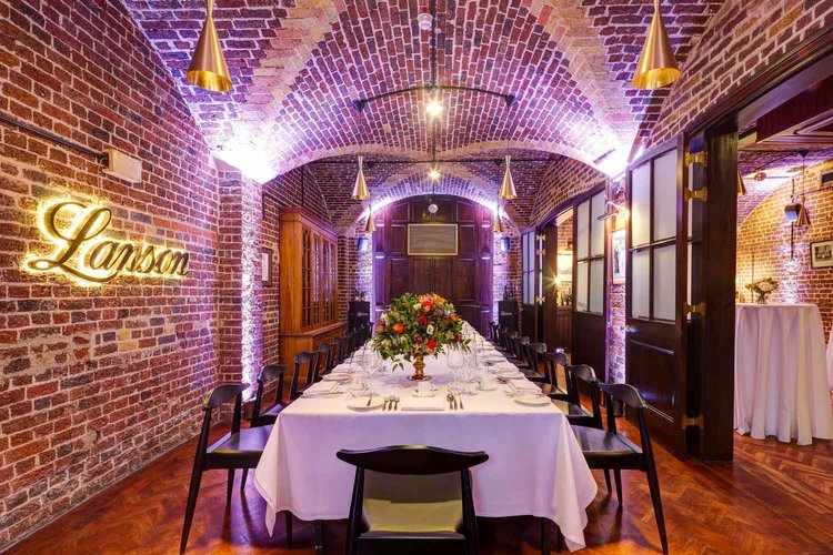 Champagne Bar at 116 Pall Mall: elegant event space with exposed brick for corporate dinners.