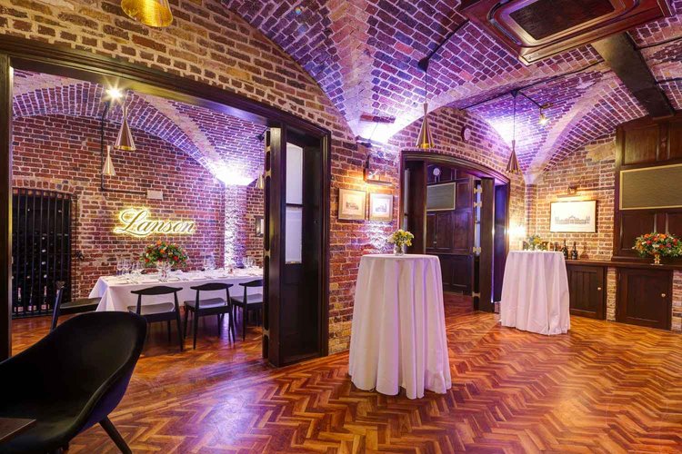 Champagne Bar at 116 Pall Mall: elegant event space with exposed brick for gatherings.