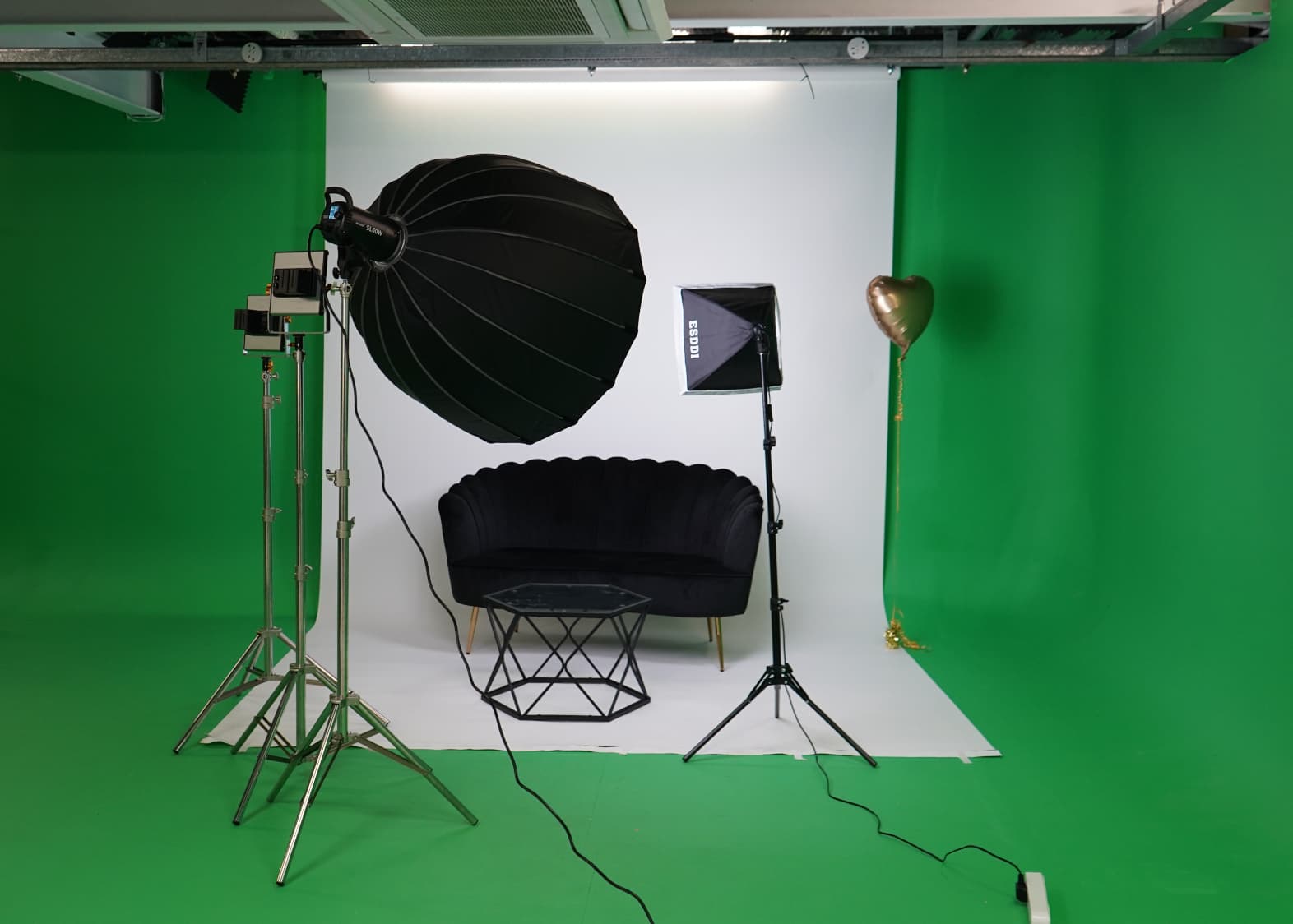 A&B Films Studio with green screen setup for virtual events and photo shoots.