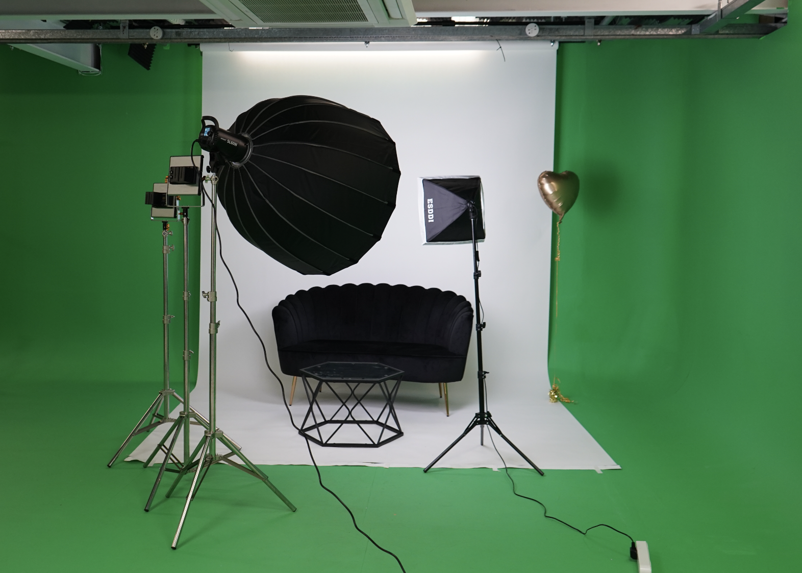 A&B Films Studio with green screen setup for virtual events and photo shoots.