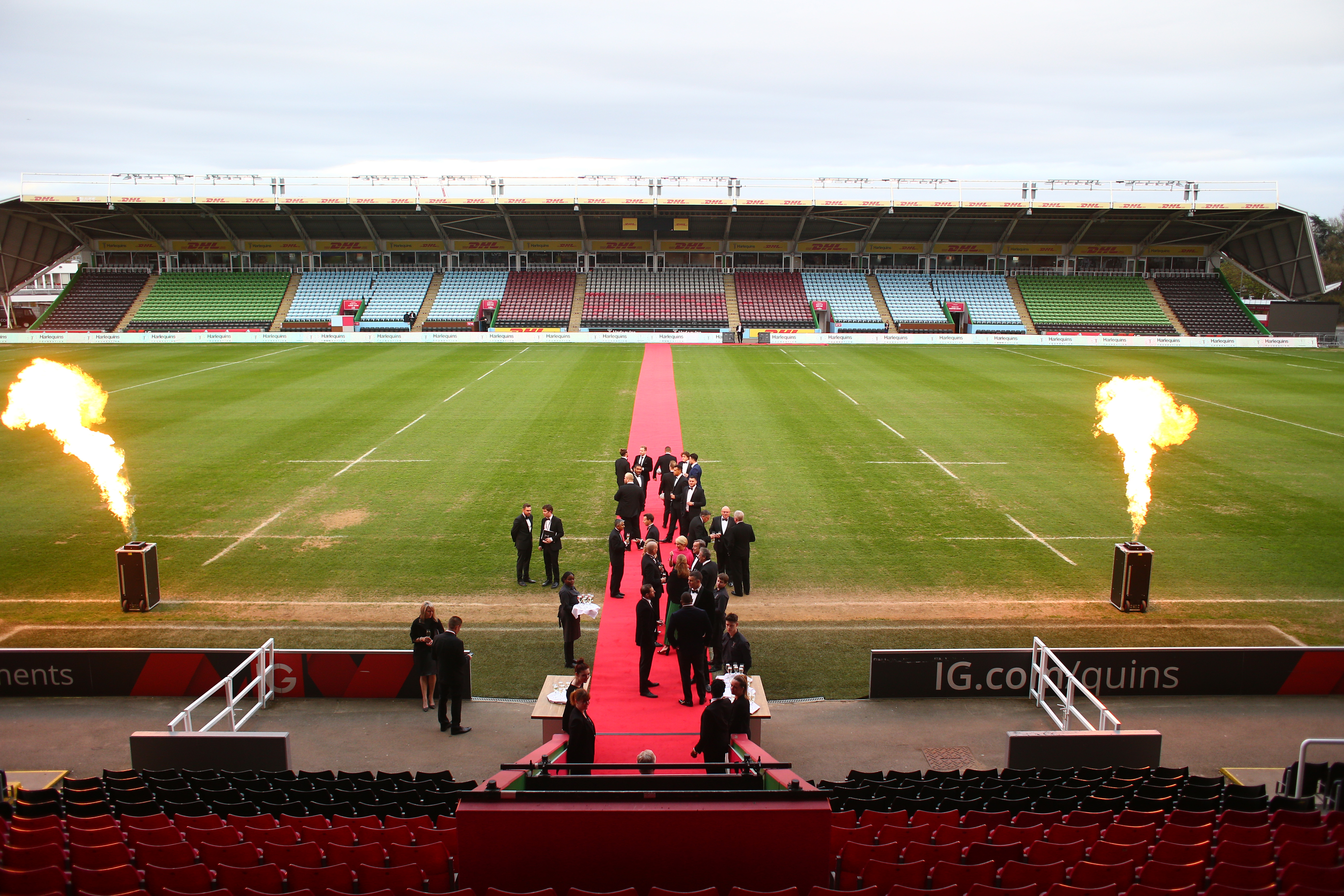 Outdoor event setup at Twickenham Stoop Stadium with red carpet and flame effects.