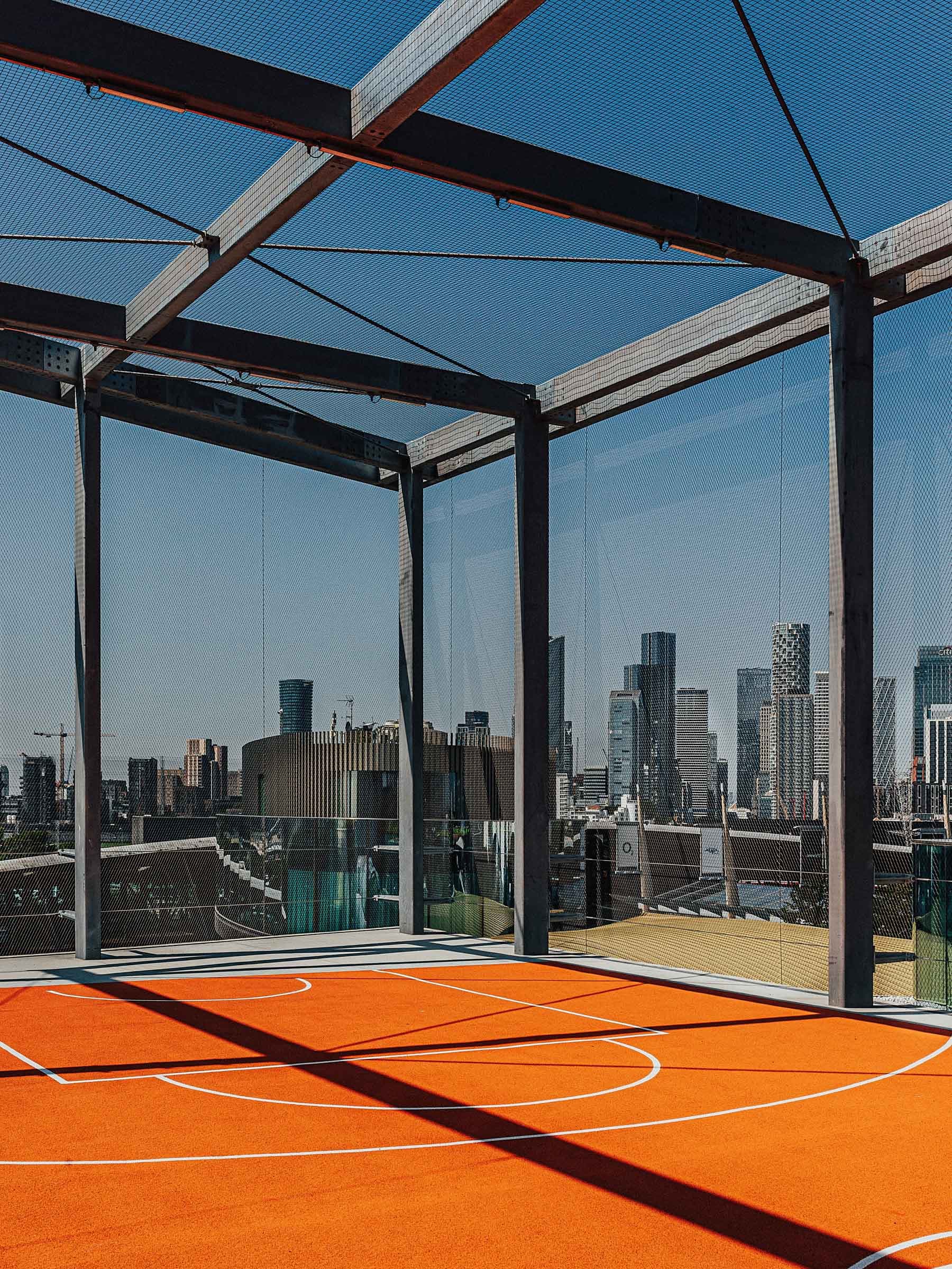 Modern event space in Design District London with urban skyline, ideal for corporate gatherings.