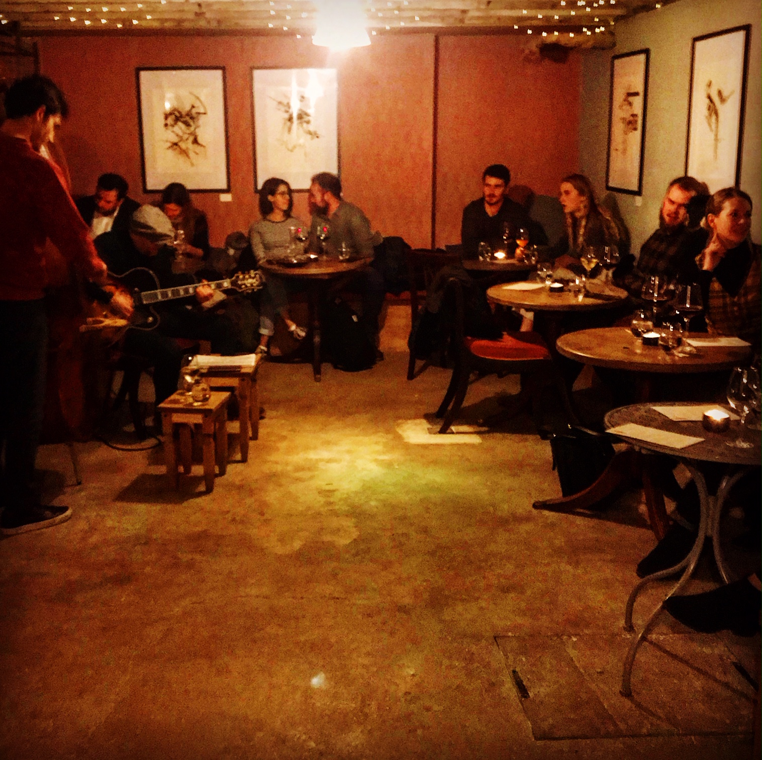Intimate venue with warm lighting for live music and social gatherings at The Cellar.