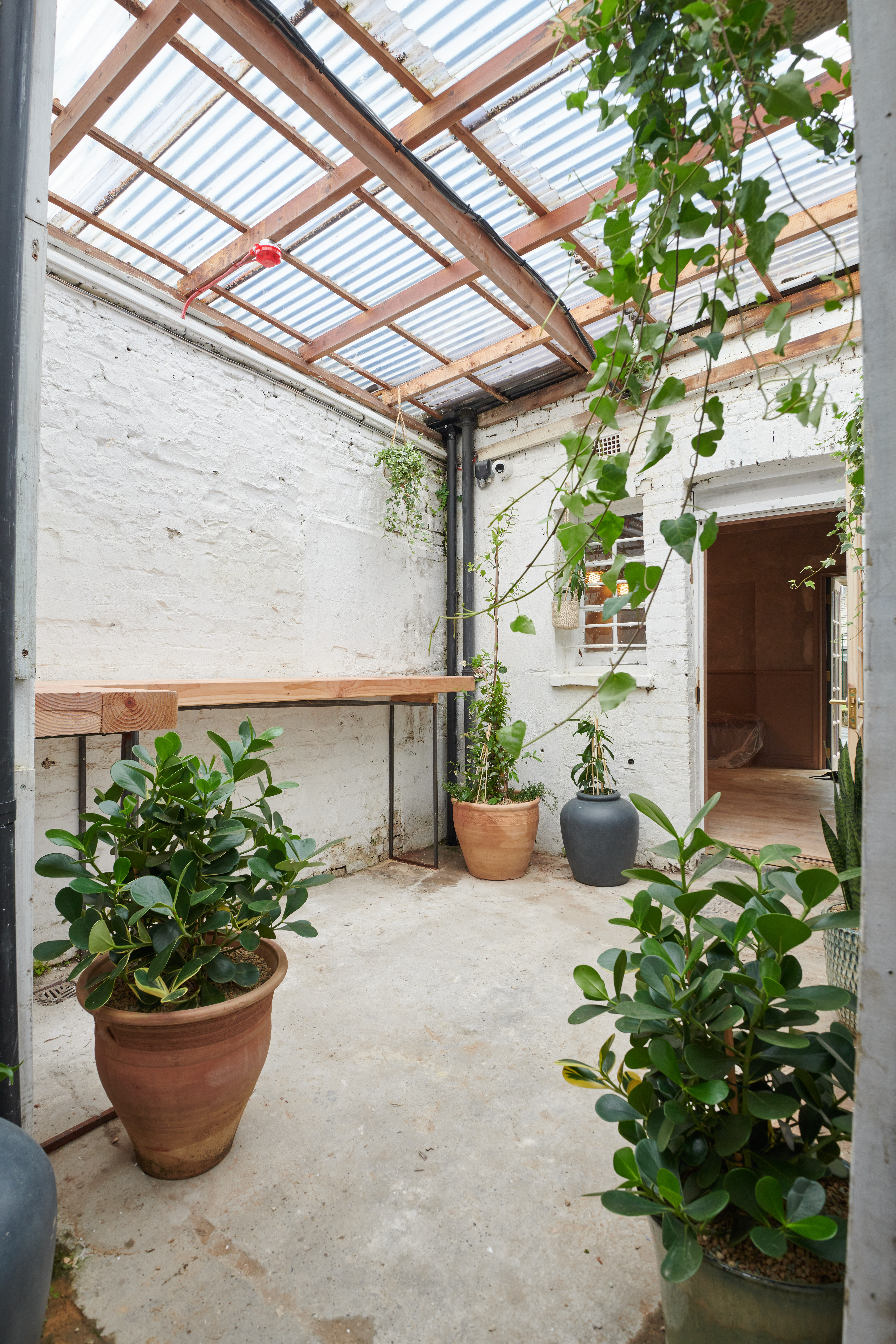 Private Snug event space with exposed brick, perfect for networking and workshops.