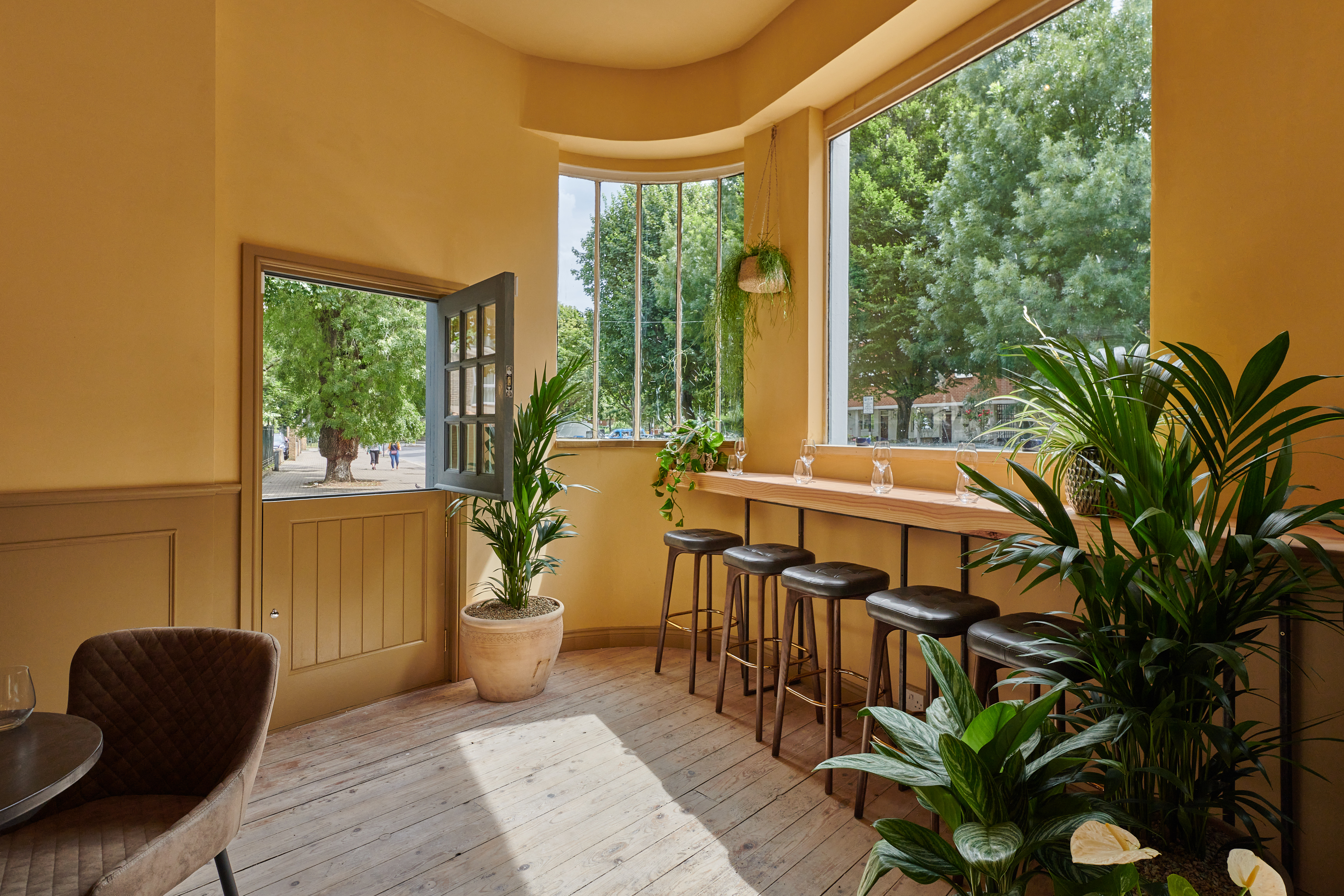 Bright venue hire with large windows, ideal for meetings and networking events.