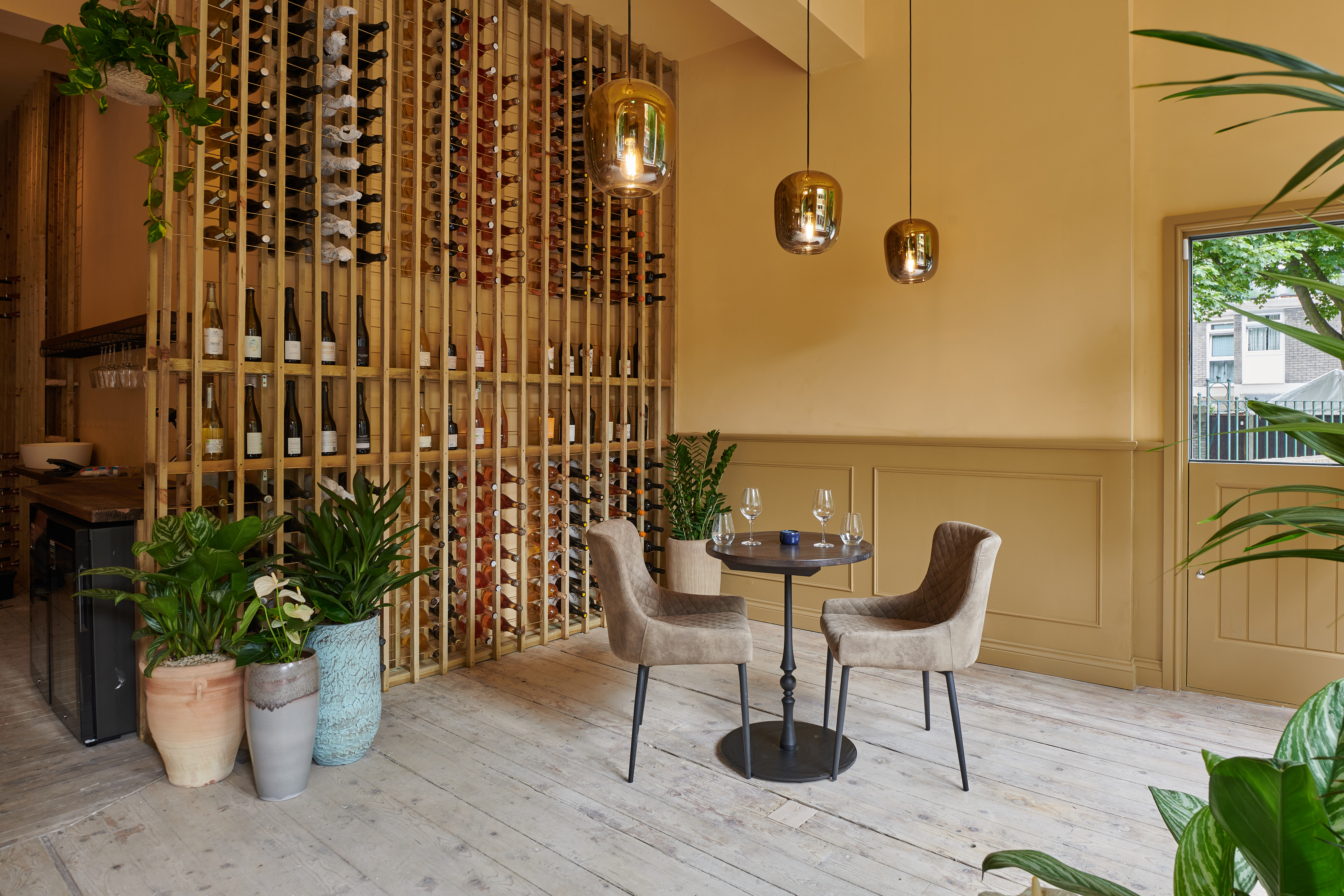 Stylish full venue hire for intimate meetings with elegant decor and wine display.