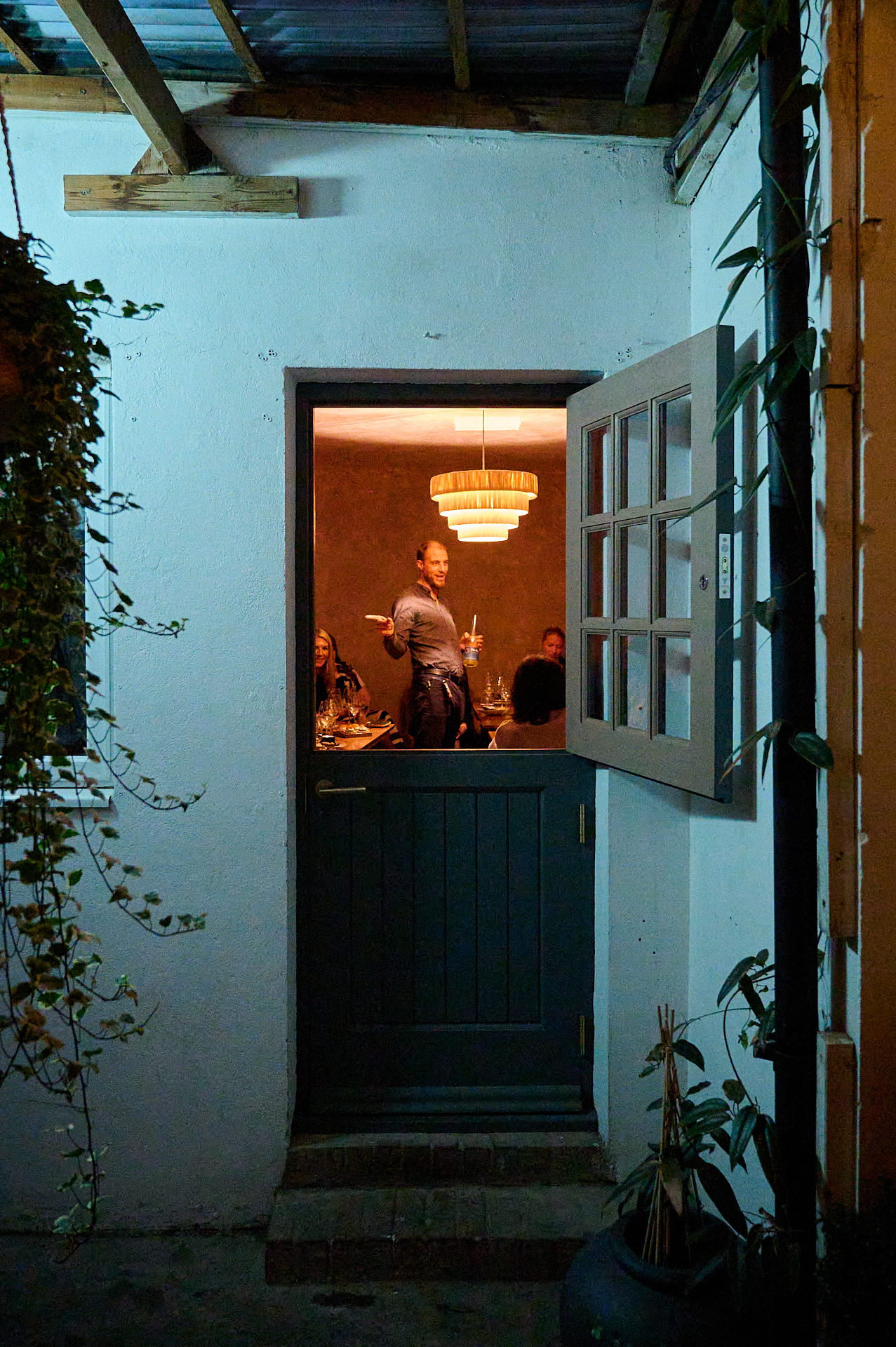 Welcoming entrance of Full Venue Hire for intimate gatherings with warm lighting.